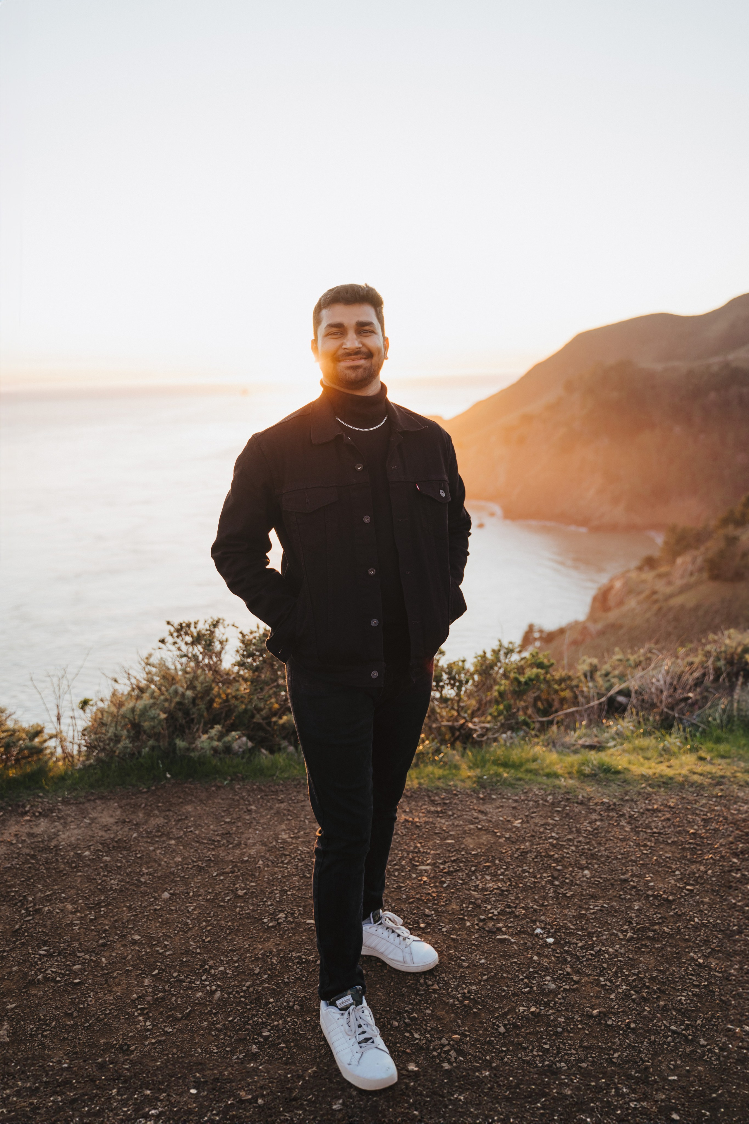 Proposal.  Overlooking the golden San Franisco Bridge sunset with a couple. Photographer Video. 
