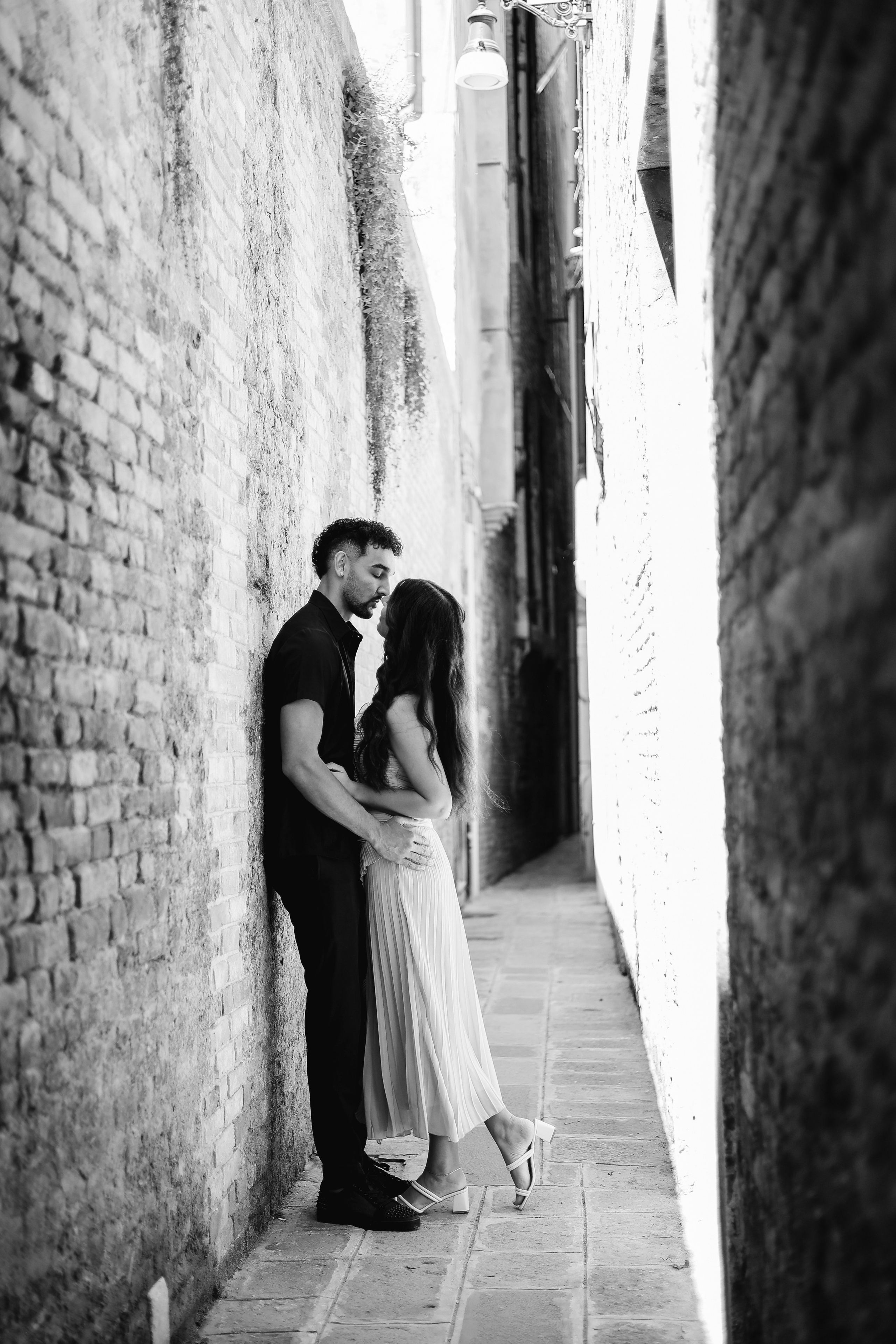 Romantic couple walking through Venice streets