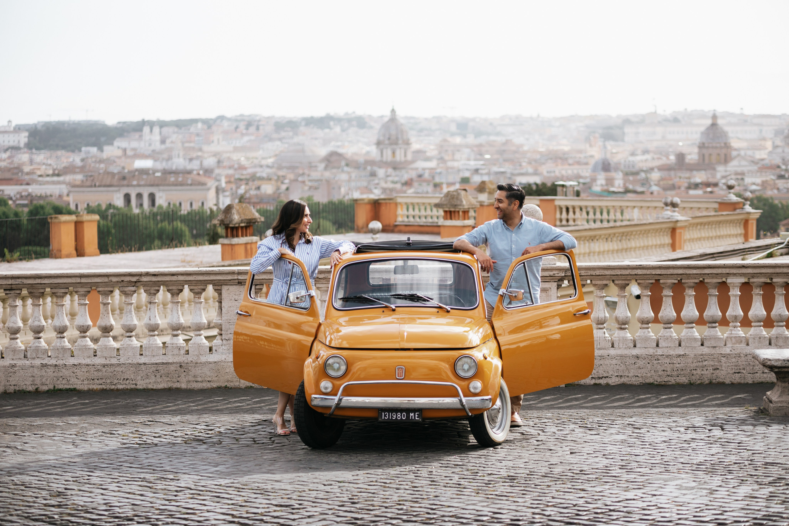 Fiat 500 and Vespa. Photographer in Rome