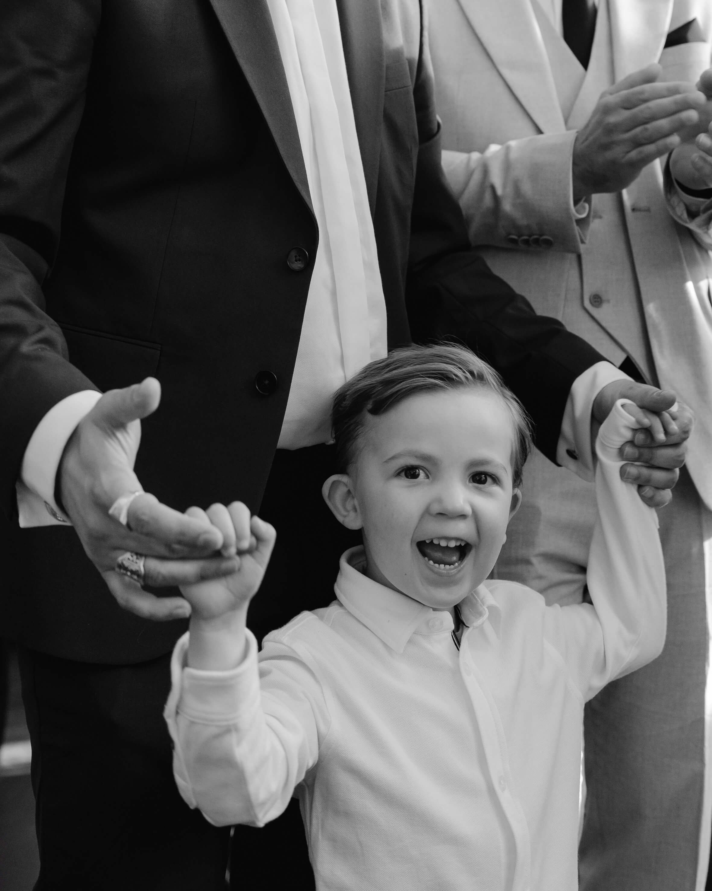 Black and white photo of a guest enjoying the wedding reception and taking a selfie, fun and lively party moment at a Munich wedding by Inna Zaytseva