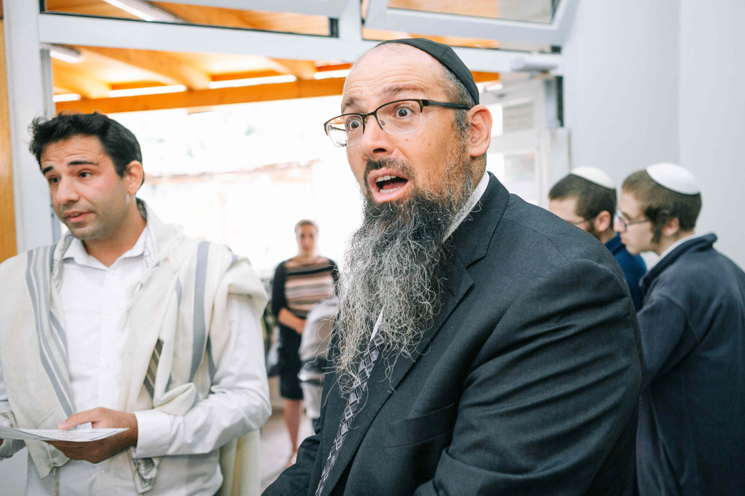 BRITH MILA IN THE SMALL SYNAGOGUE. PHOTOGRAPHER IN ISRAEL