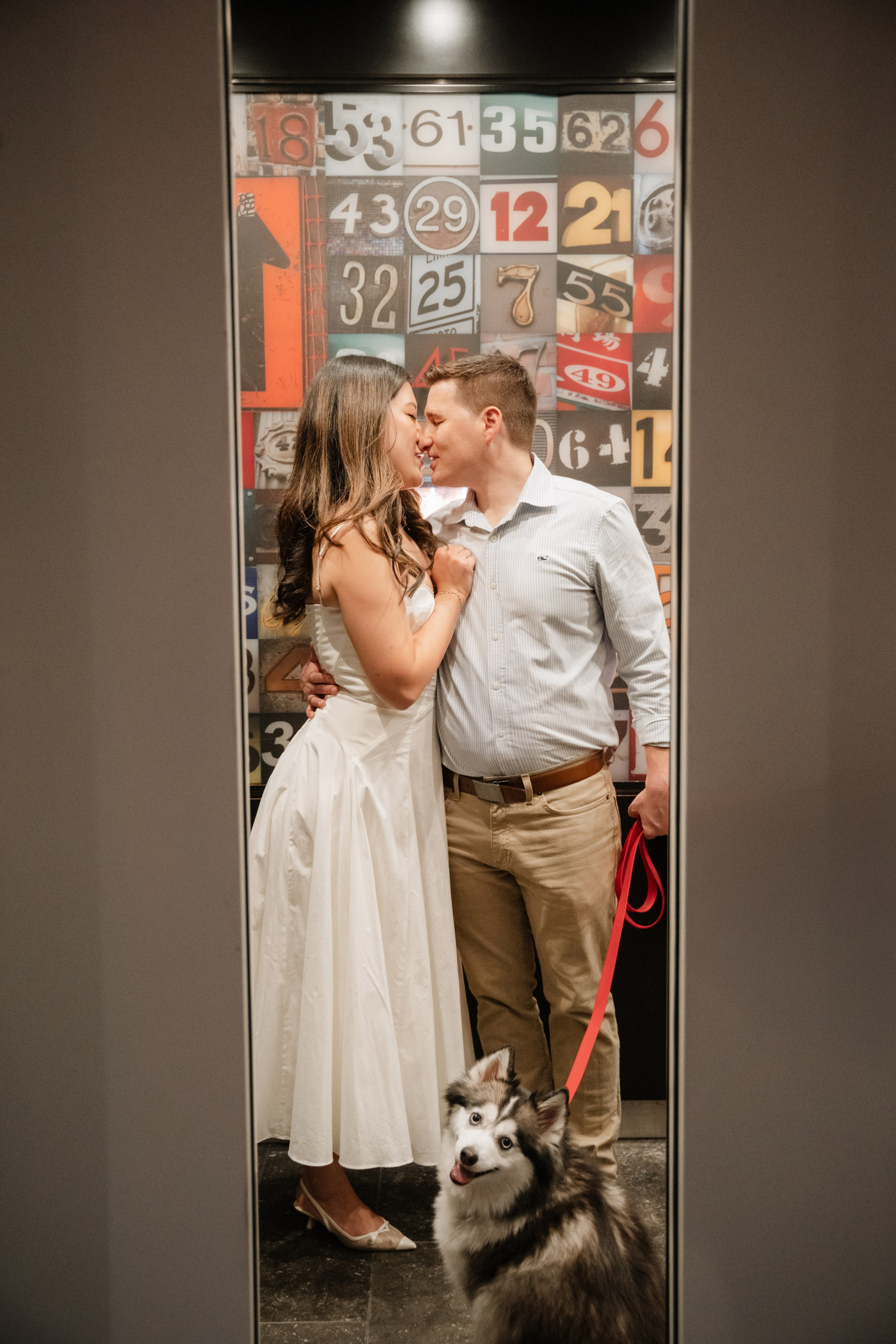 An adorable couple with their dog. Portrait and wedding photographer in New York