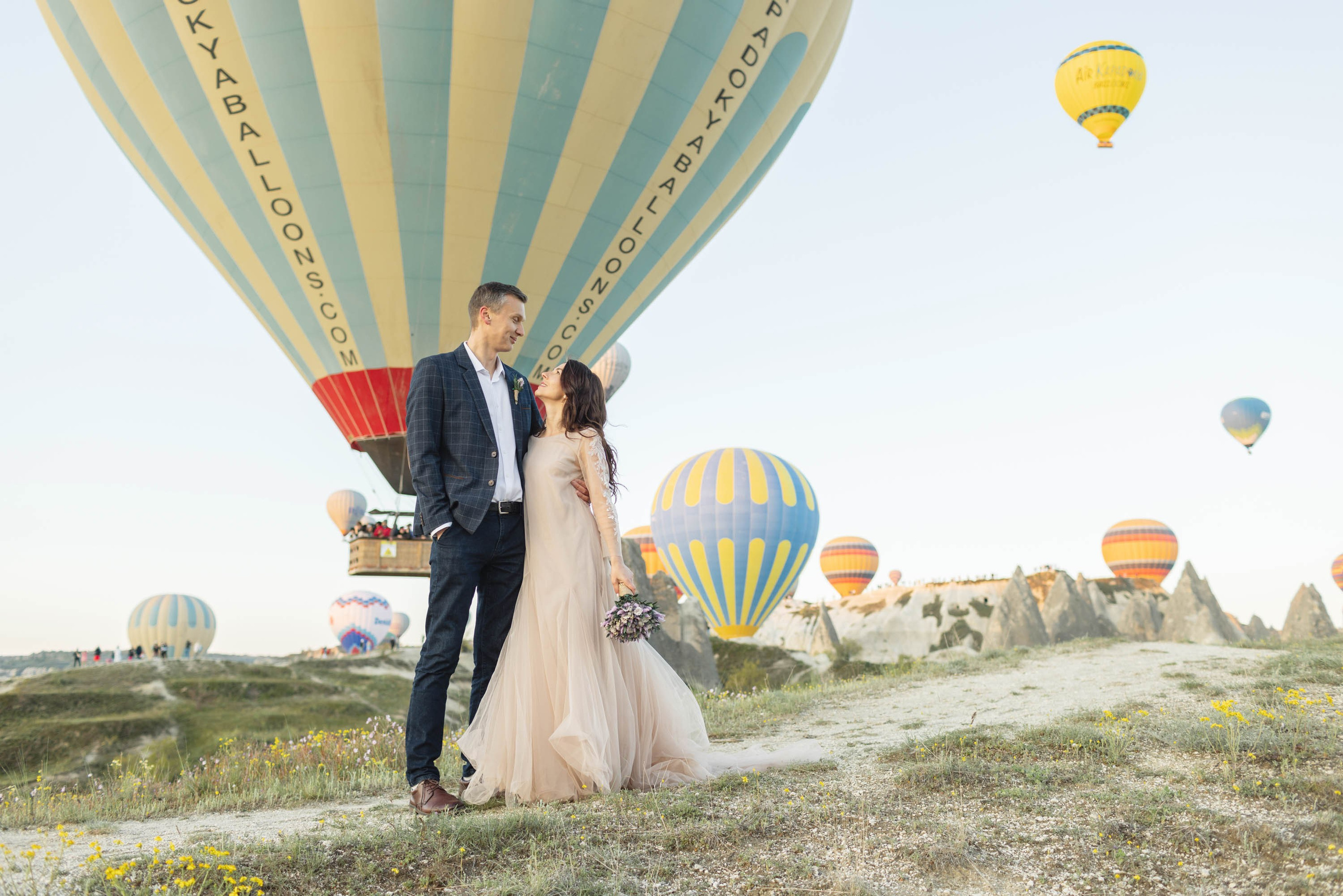 Magical Wedding Photoshoot in Cappadocia: Balloons, Caves, and Valleys. Julia Ganch I Fashion Wedding Photography I Cappadocia Turkey