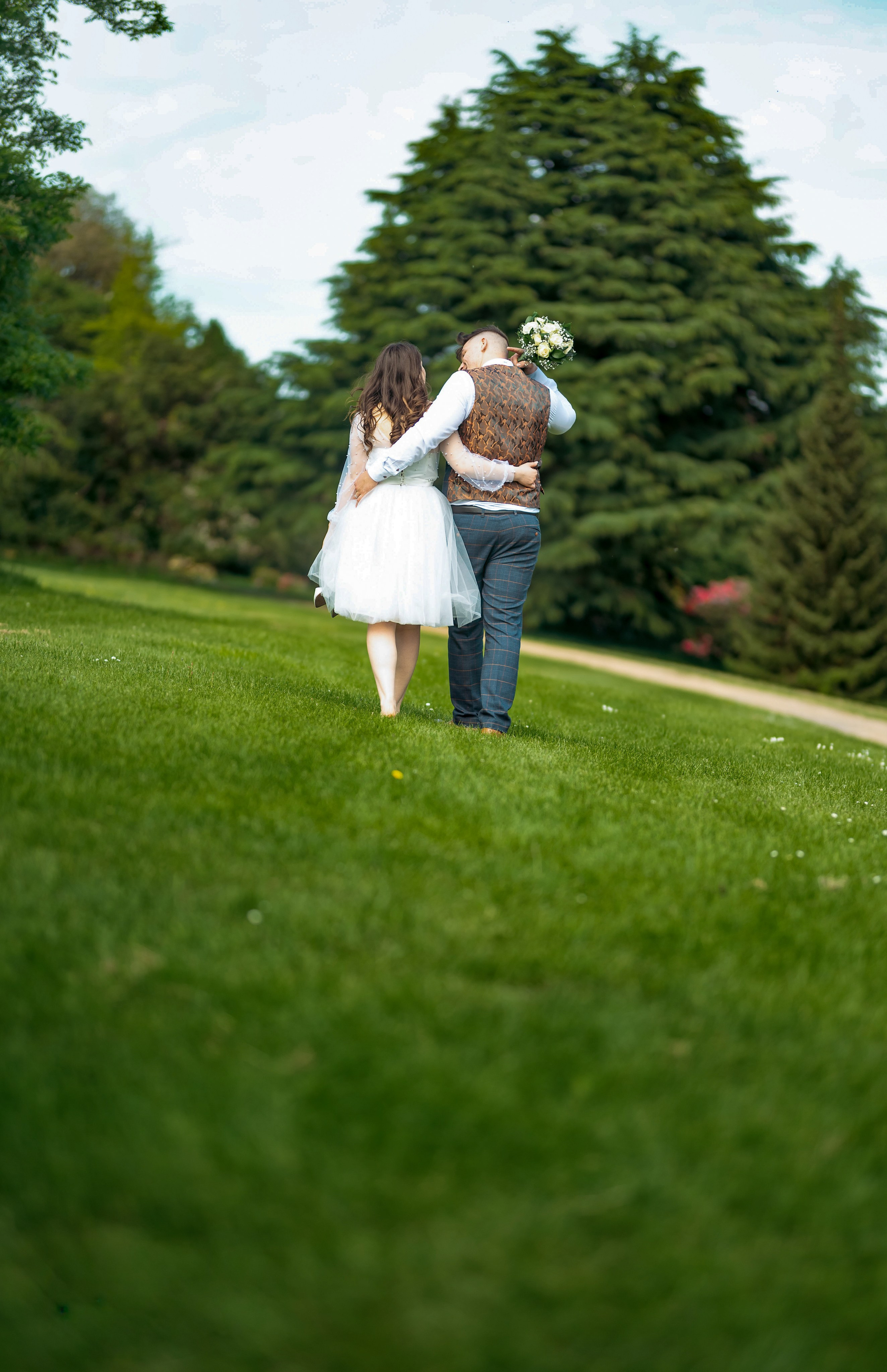 Bride and groom in a mansion doorway at Luton Hoo, warm light