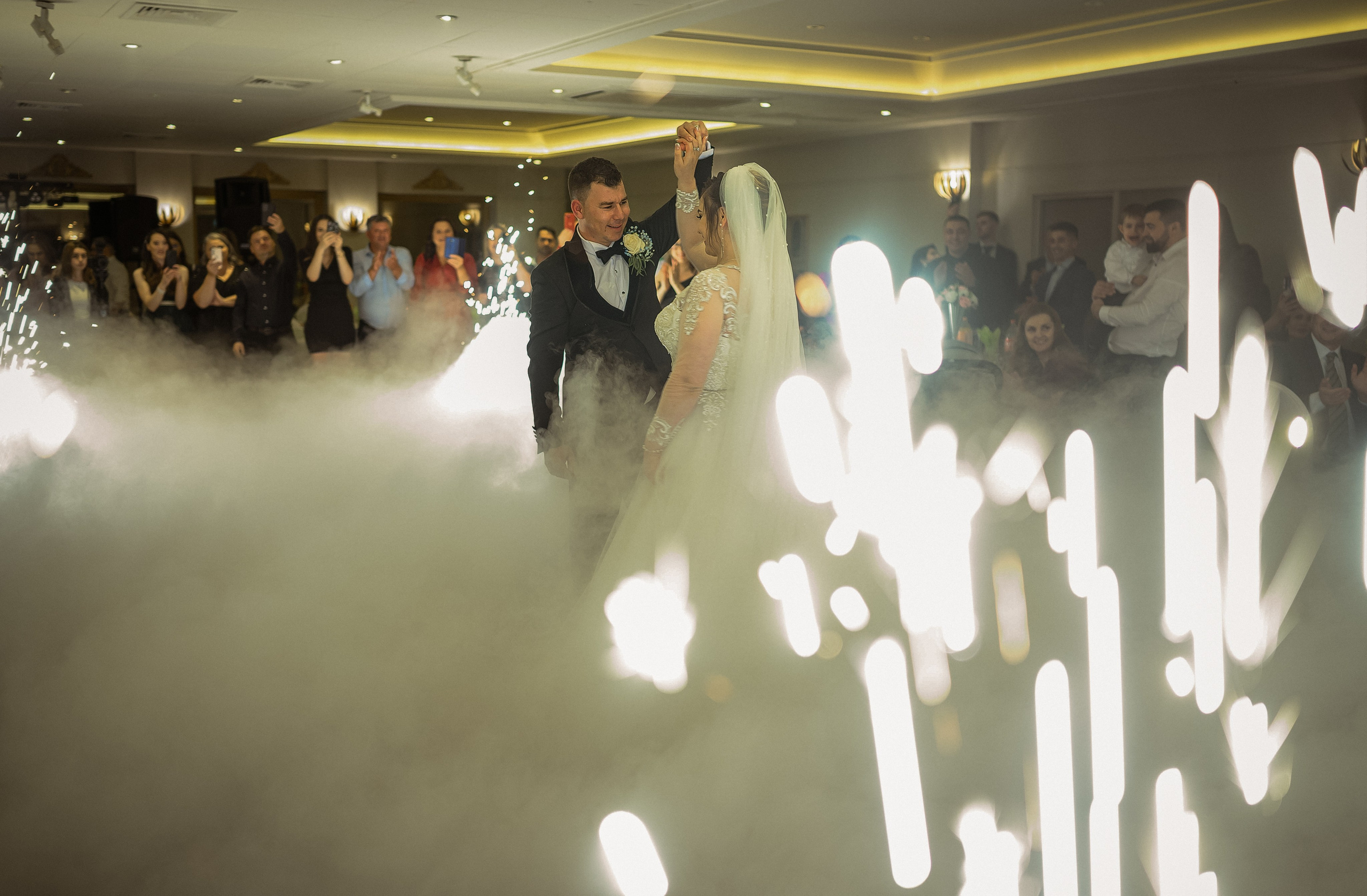 The couple’s first dance surrounded by dramatic dry ice and stage lighting