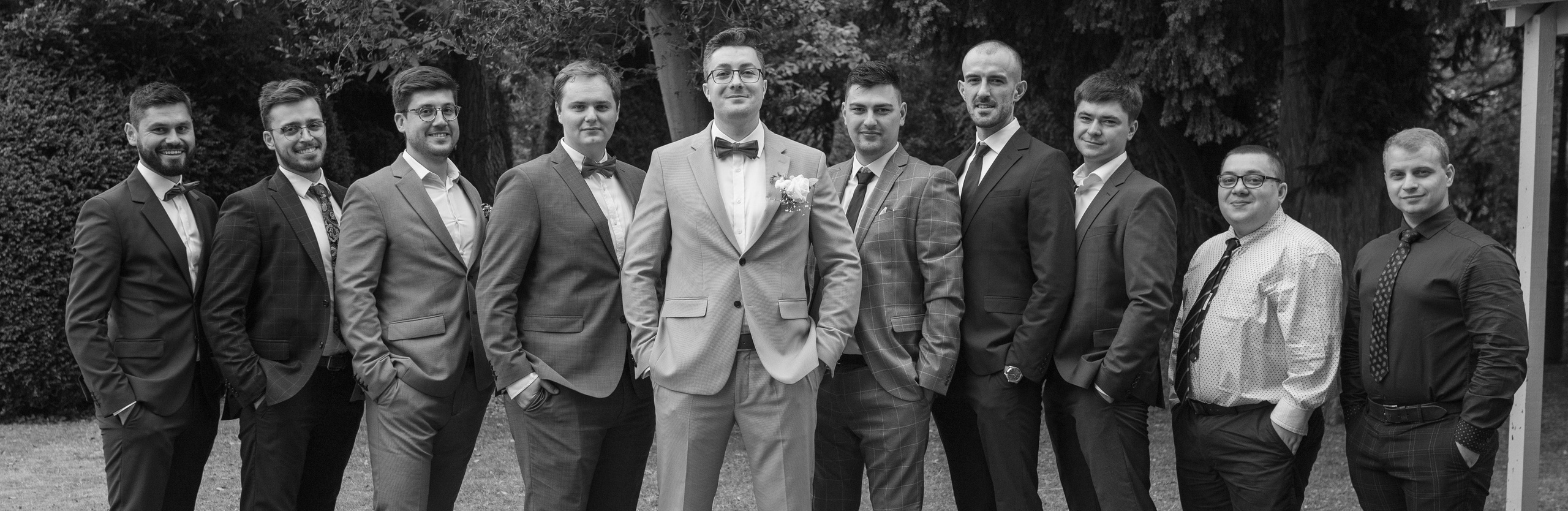 Groom and groomsmen group portrait, black and white (black and white)