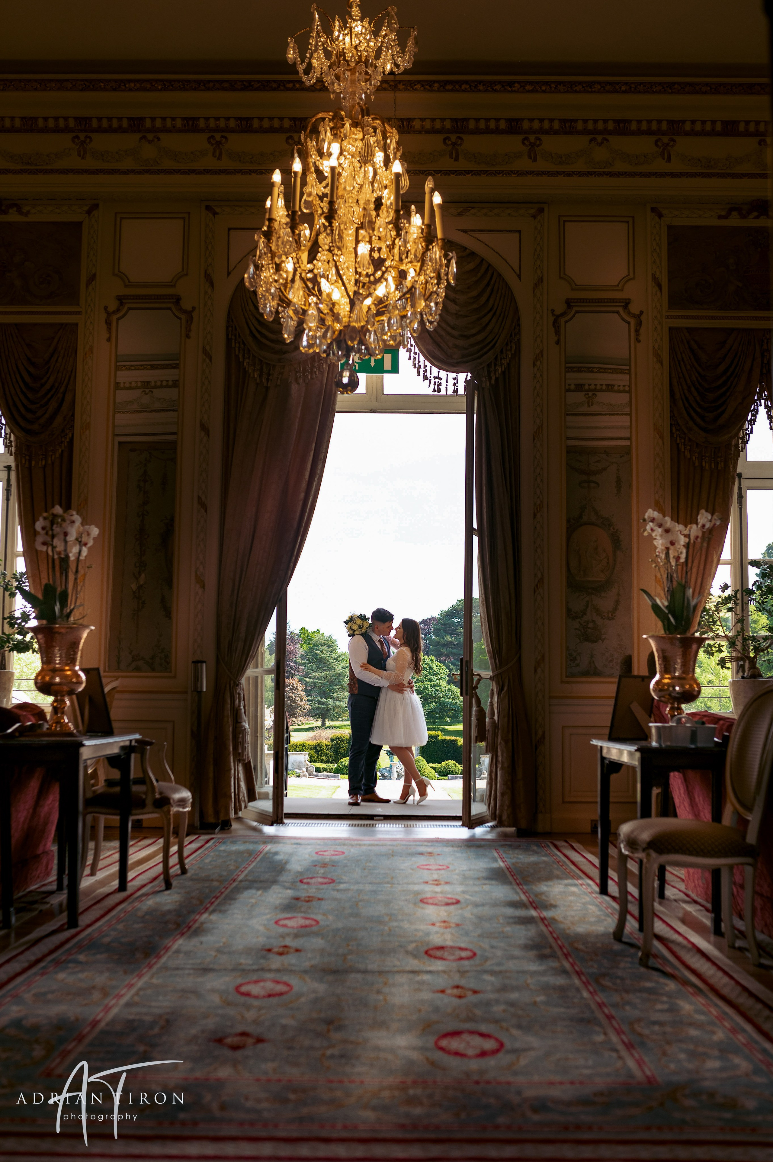 Bride and groom standing together on the lawn at Luton Hoo