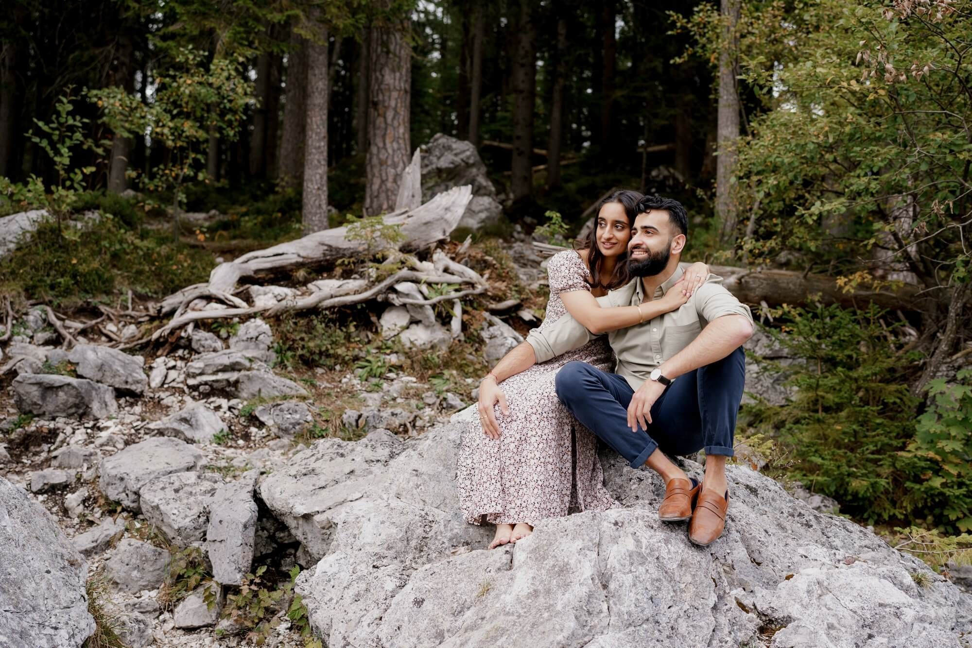 Couple close portrait - man with arm around smiling woman at Eibsee during engagement session in Bavaria