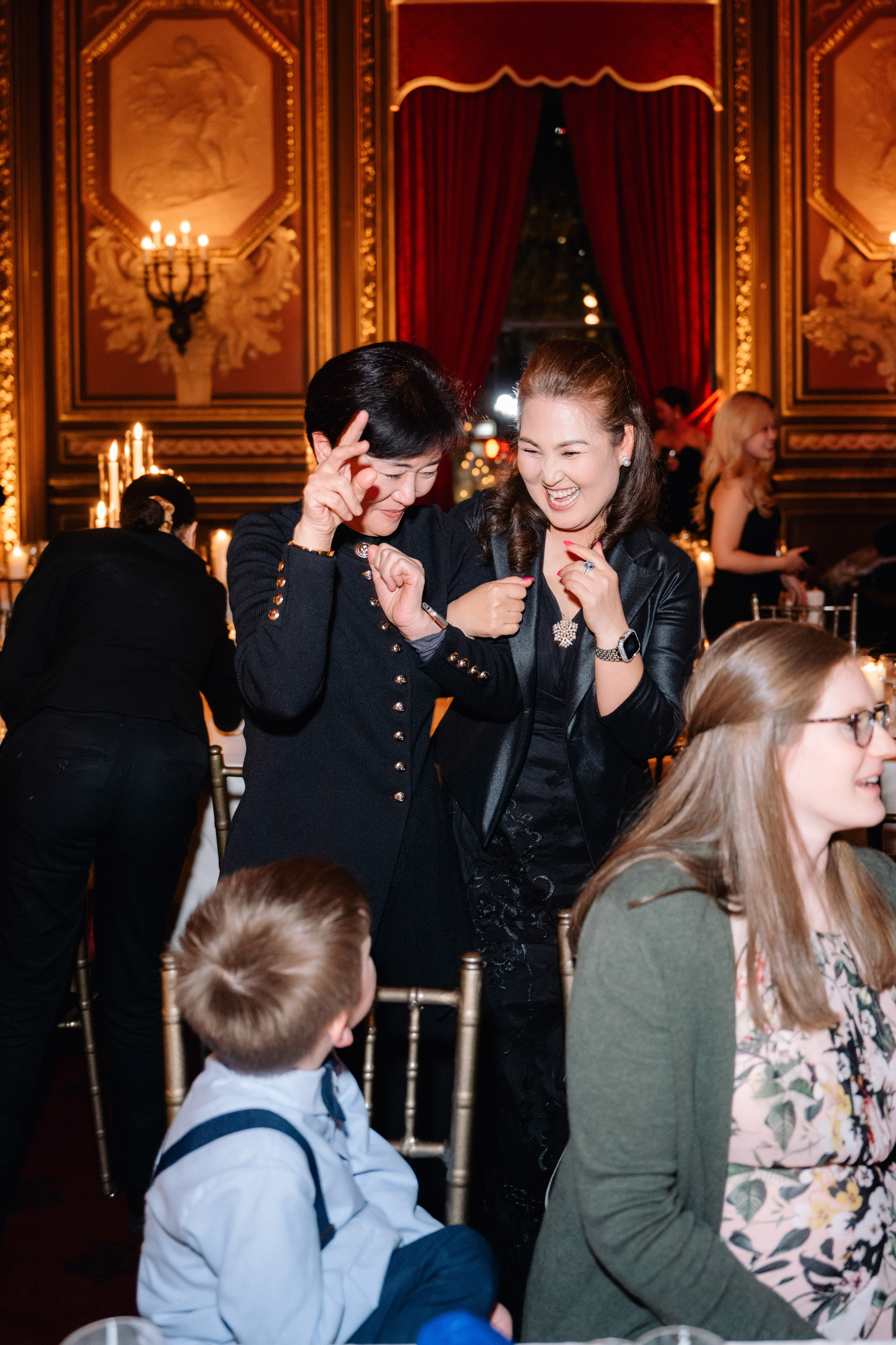 a group of people sitting around a table