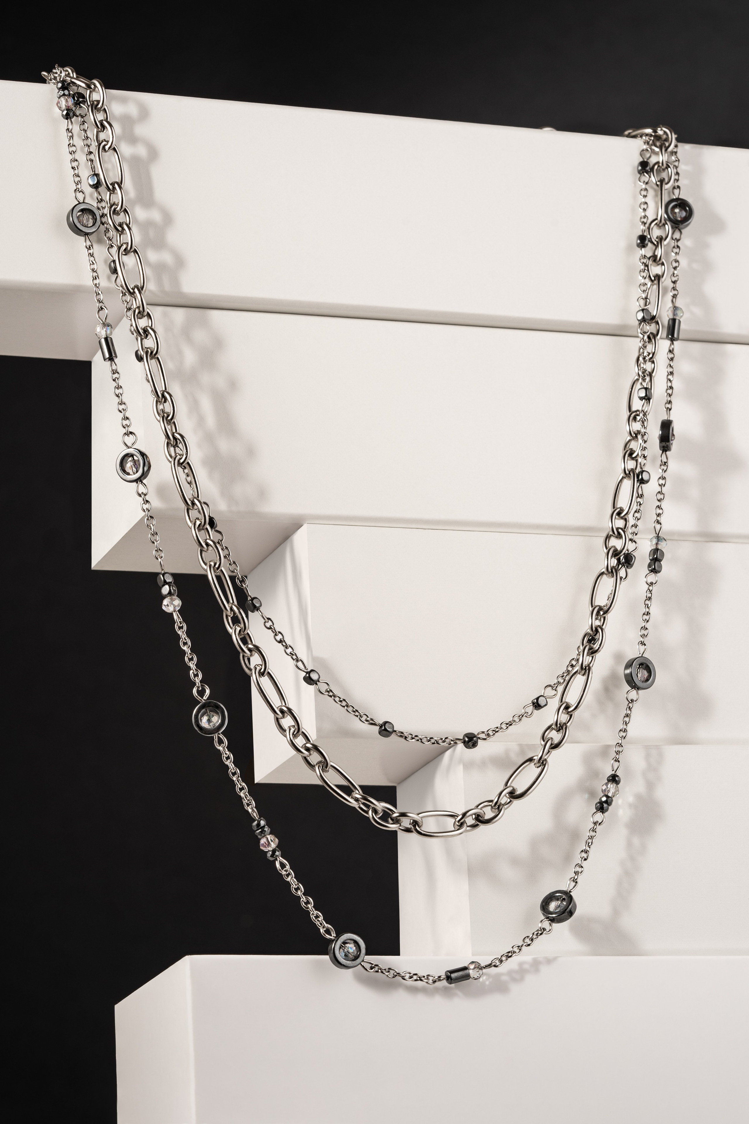 Elegant earrings on a minimalist background in a product photoshoot.