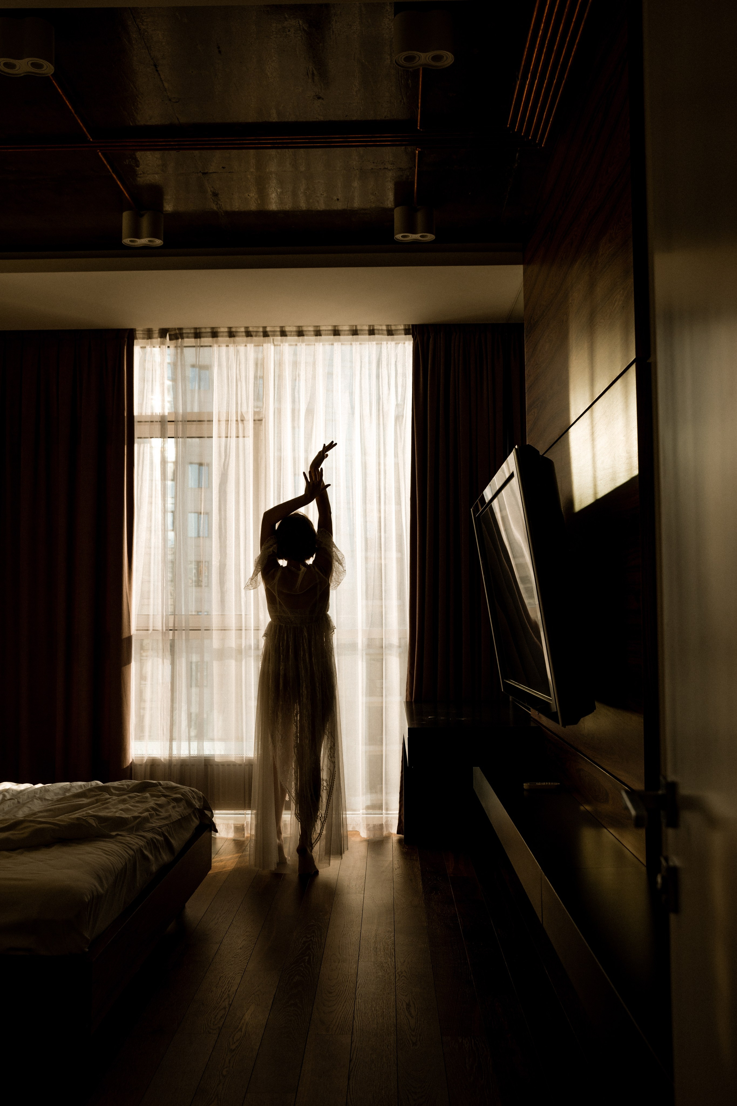 Romantic bride in white dress walking along the shoreline, wedding photographer France