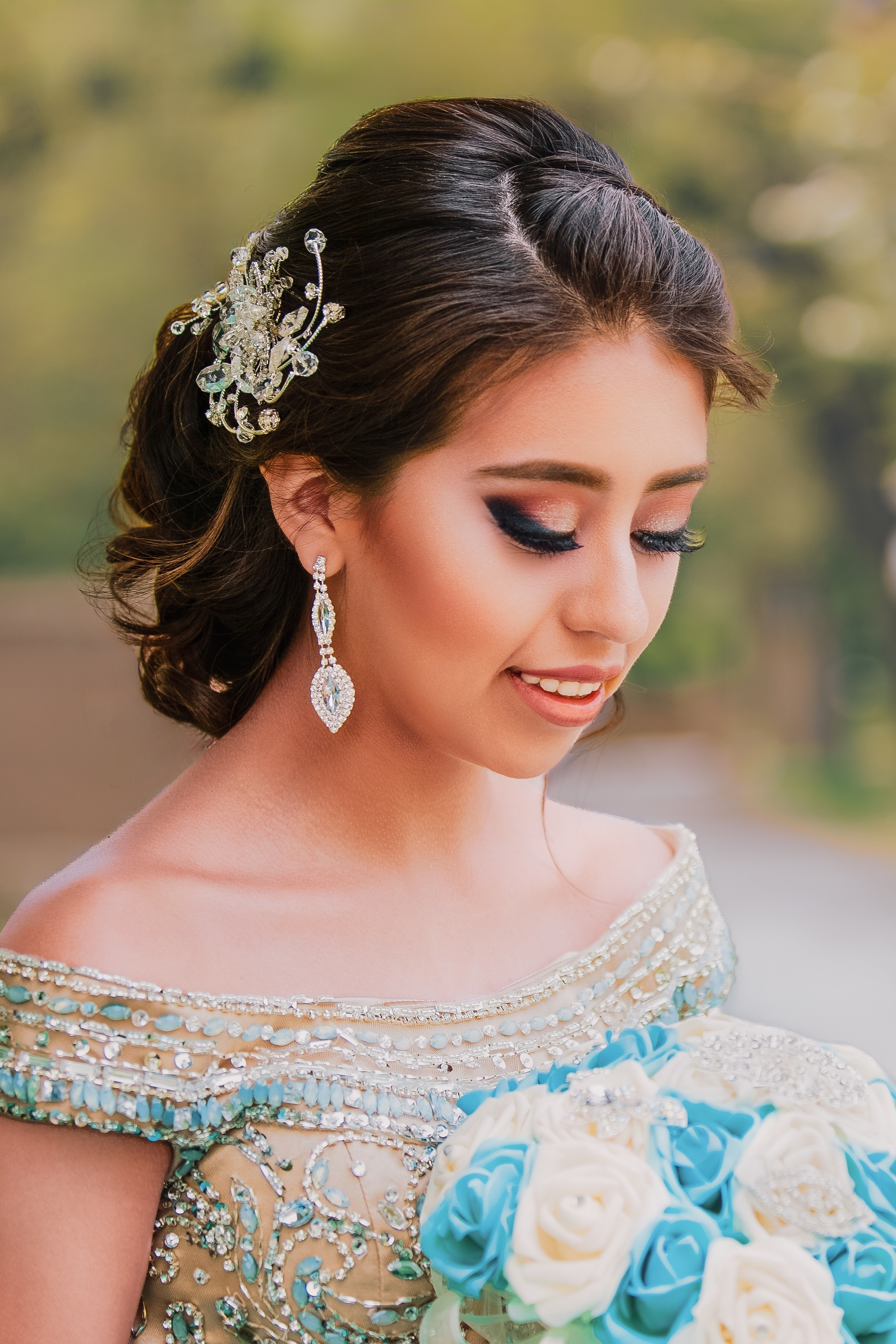 Close-up fine art quinceañera portrait with tiara and sky blue dress Central Indiana