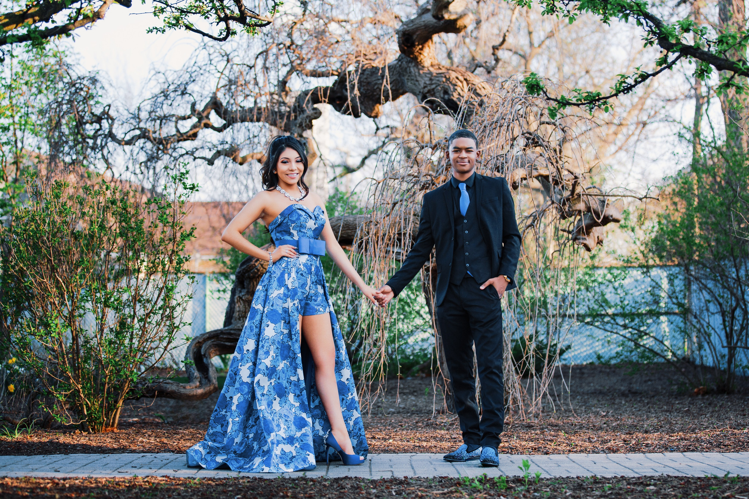 Outdoor formal couples photoshoot in Indianapolis with bespoke blue floral gown and black suit