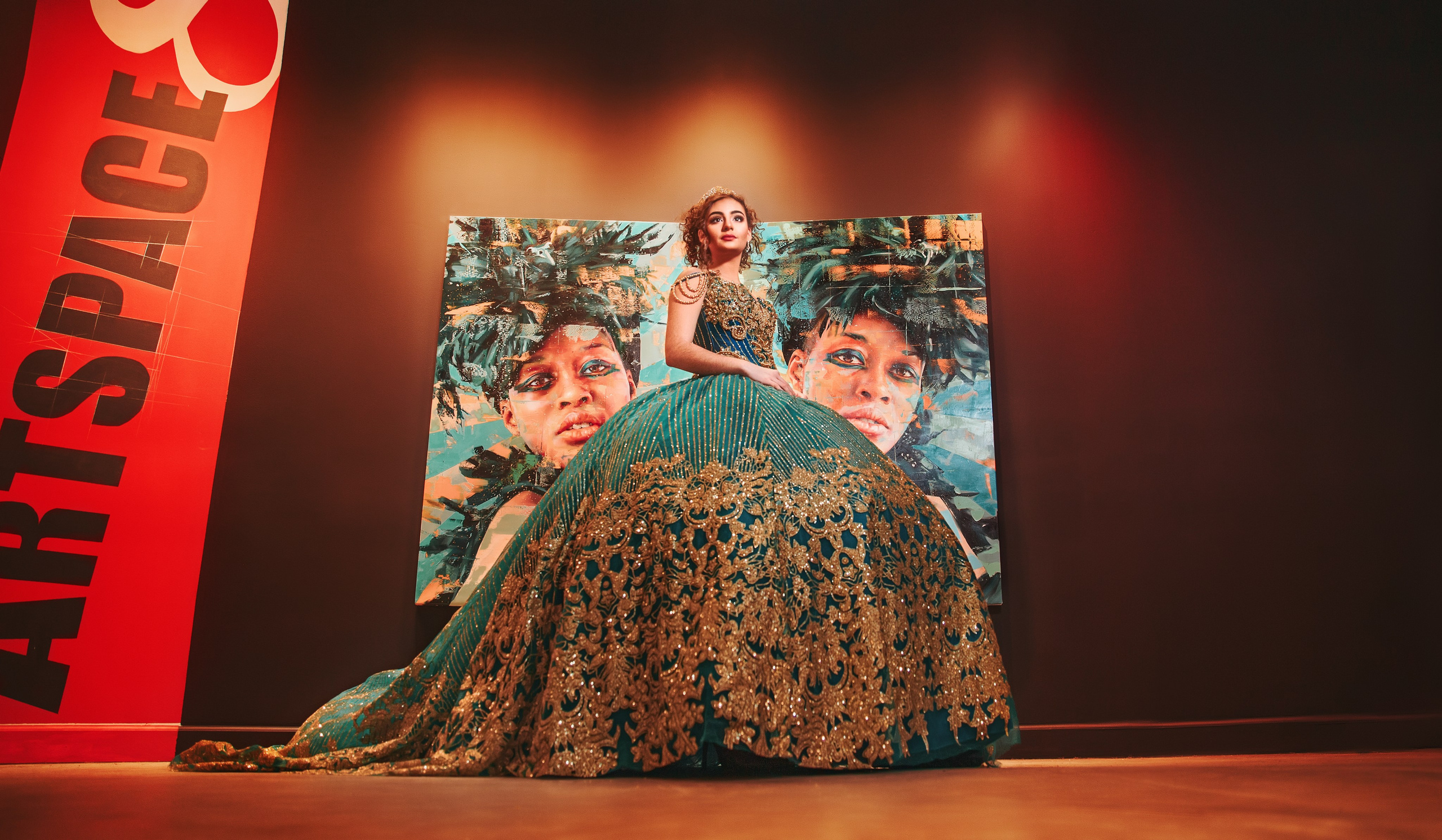 Creative quinceañera fine art photography in emerald gown at art gallery