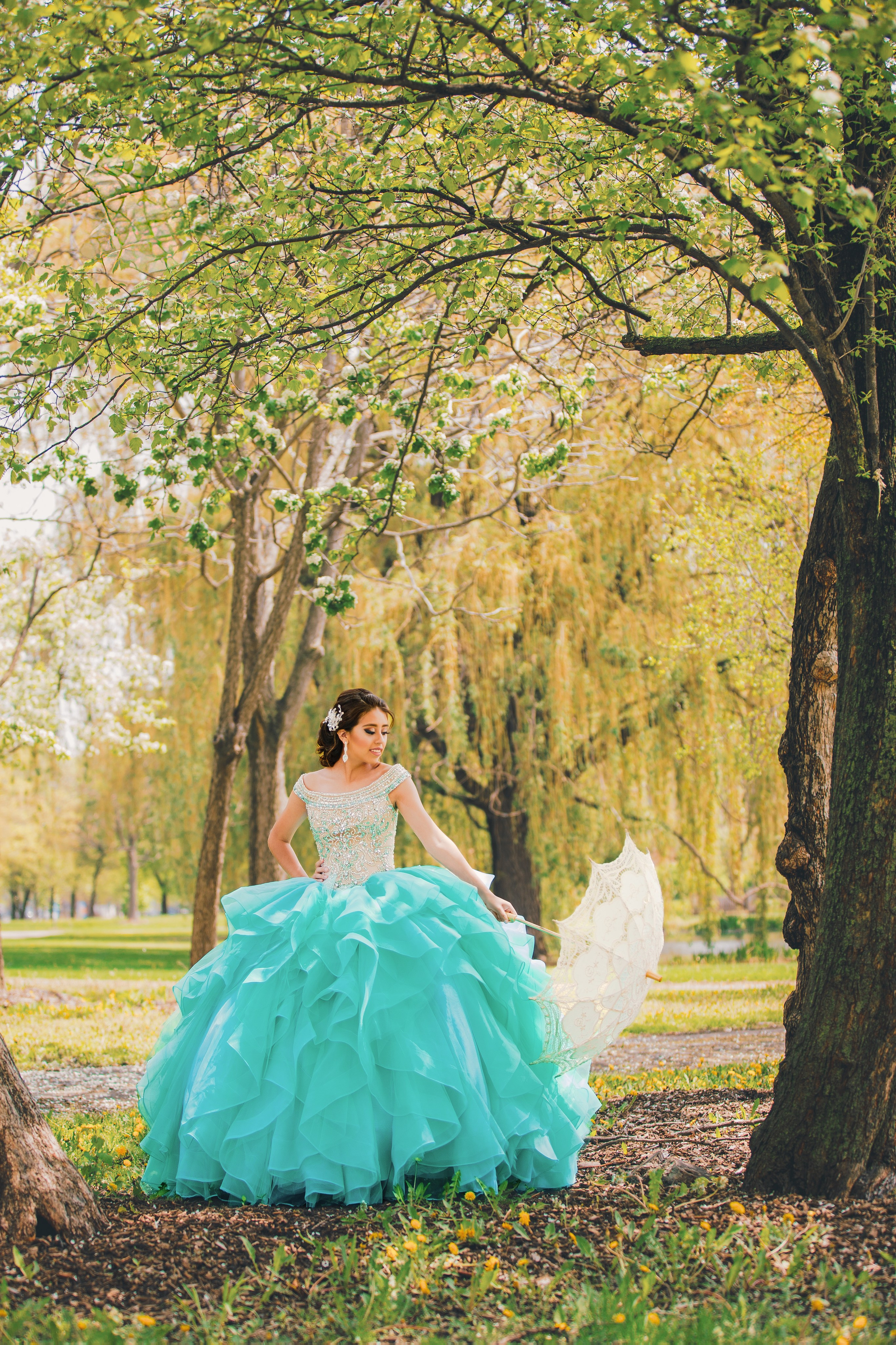 Fine art quinceañera photoshoot in sky blue gown surrounded by nature Central Indian