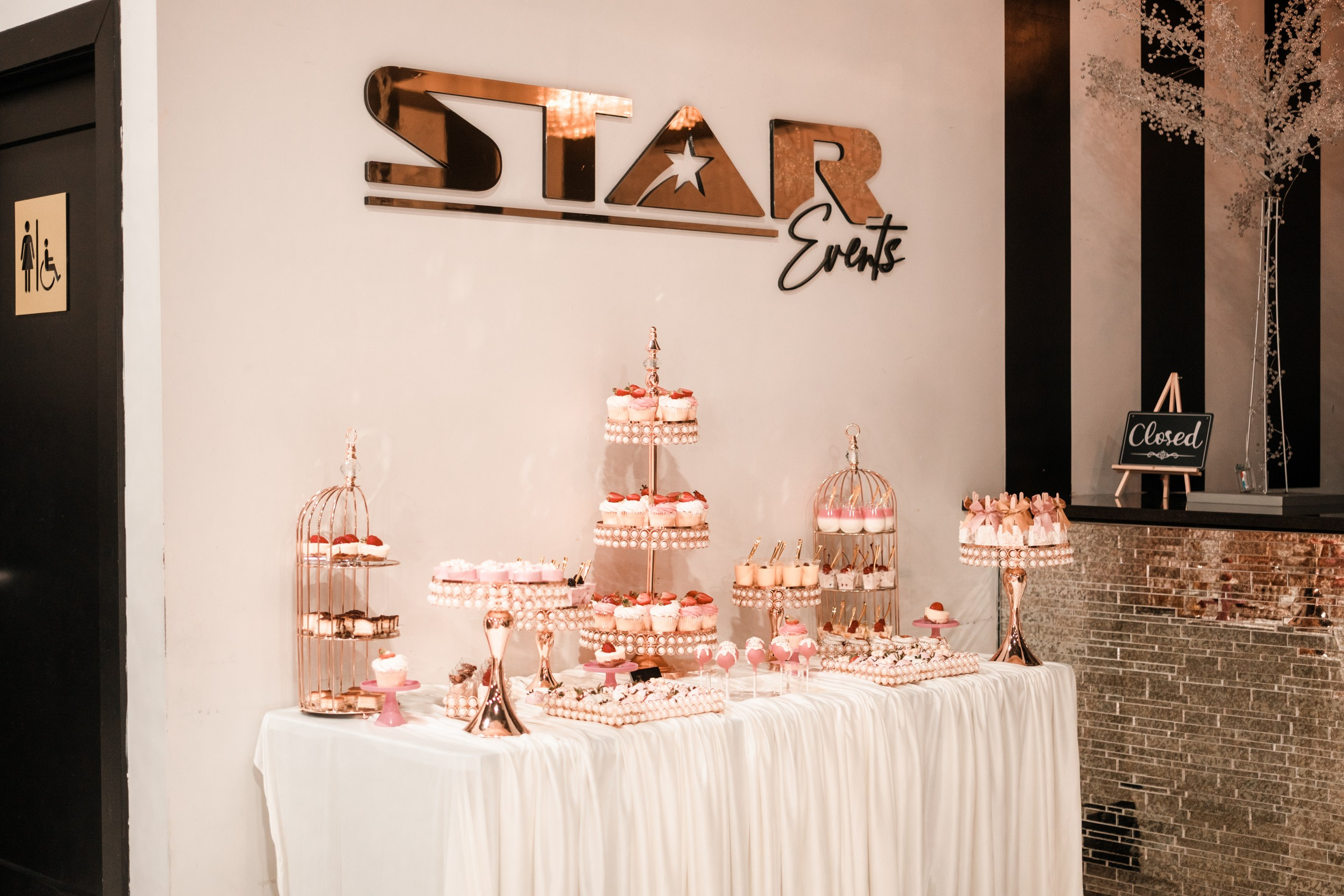 Rose gold dessert table and tiered cupcake display at Star Events venue