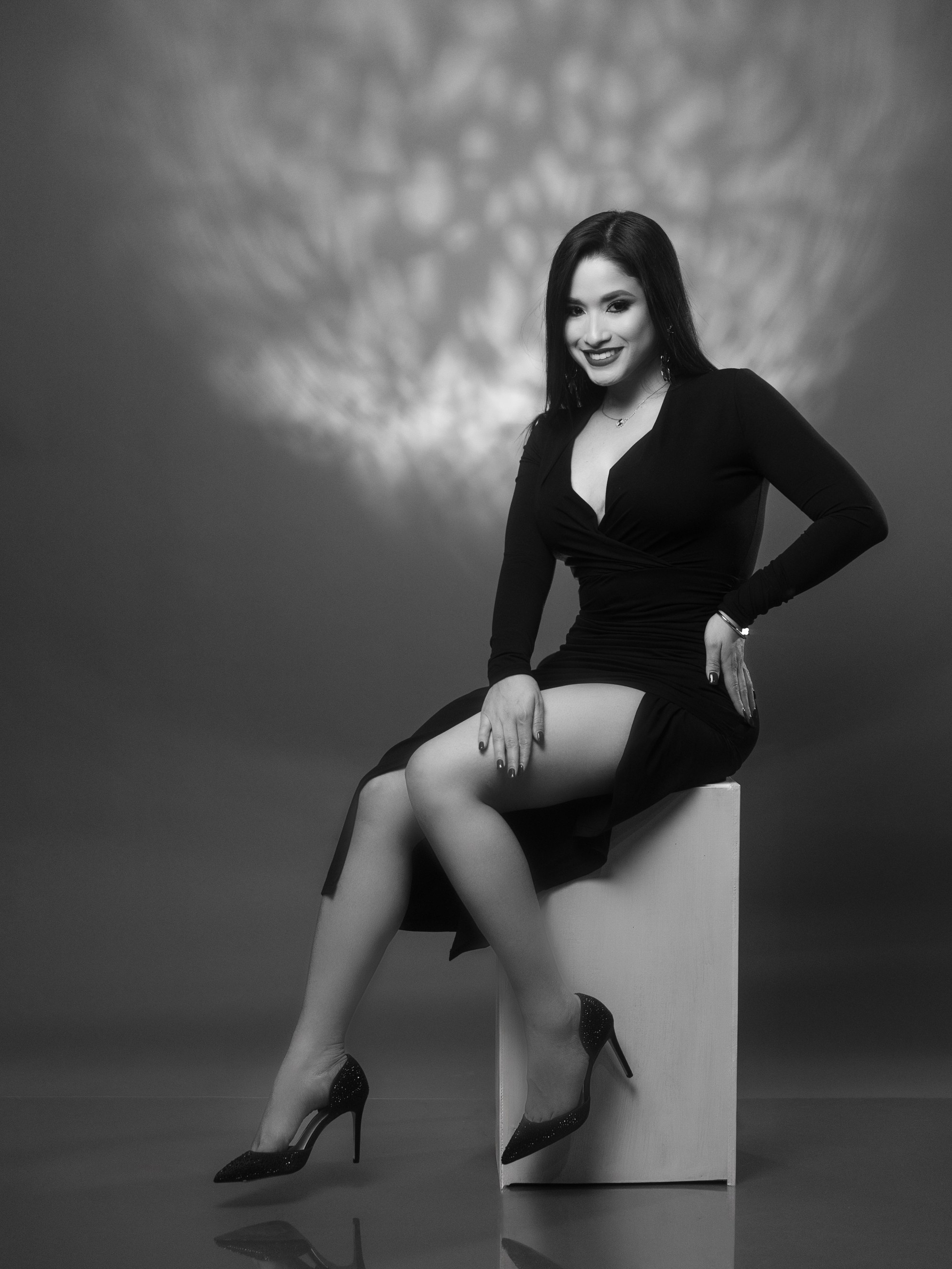 Timeless black and white fine art studio portrait with textured background light