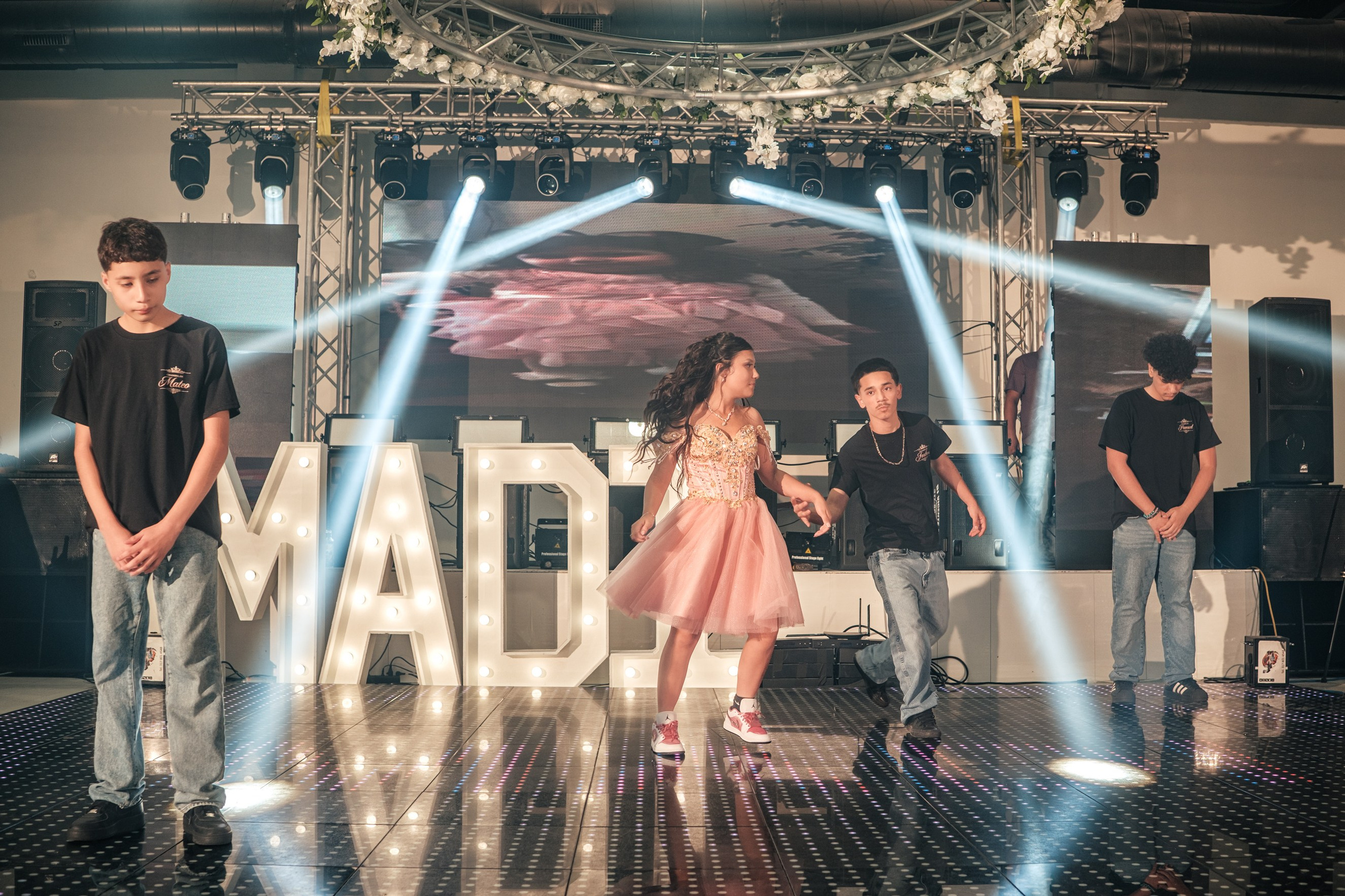 Dynamic choreographed celebration dance under stage lighting at Star Events