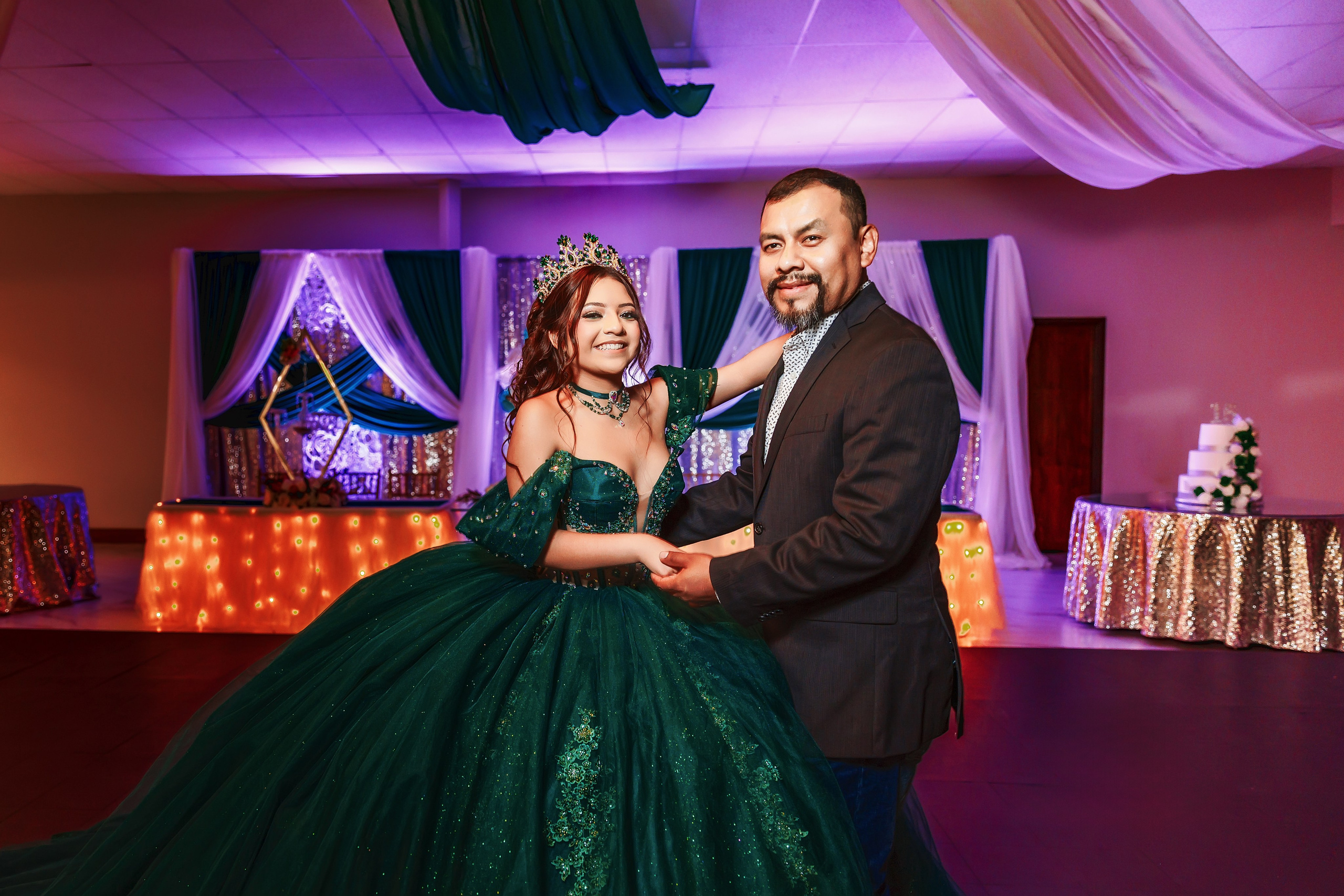 Cinematic emerald green gown quinceañera portrait along Downtown Indianapolis Canal Walk