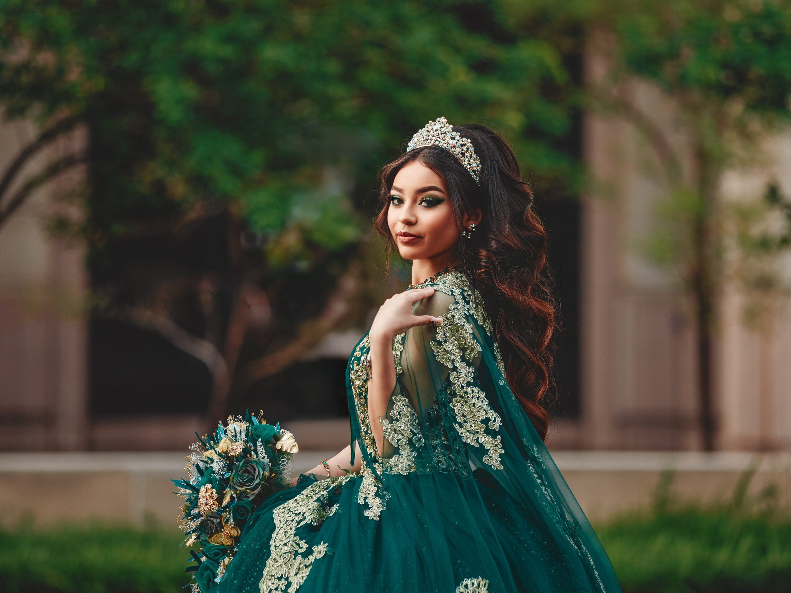 Editorial fine art quinceañera portrait with crystal crown and emerald green lace dress in Indianapolis