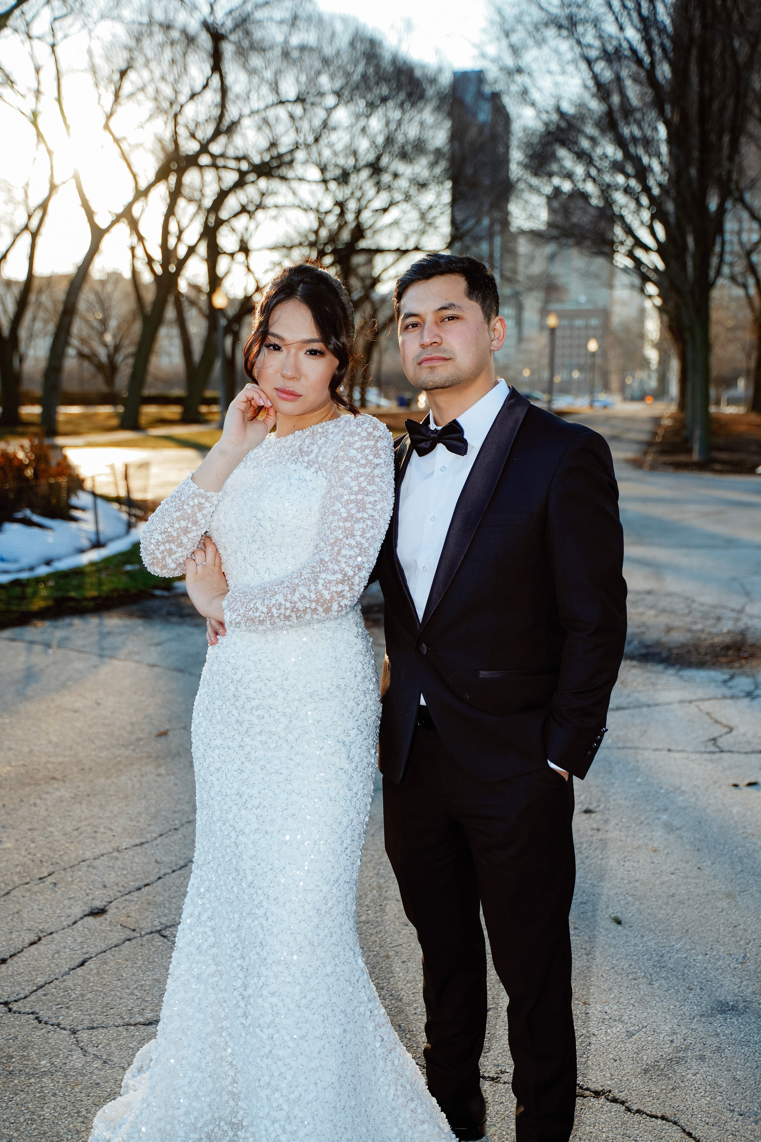 Bride and groom wedding portrait at Millennium Park Chicago with downtown skyline view and romantic city atmosphere.