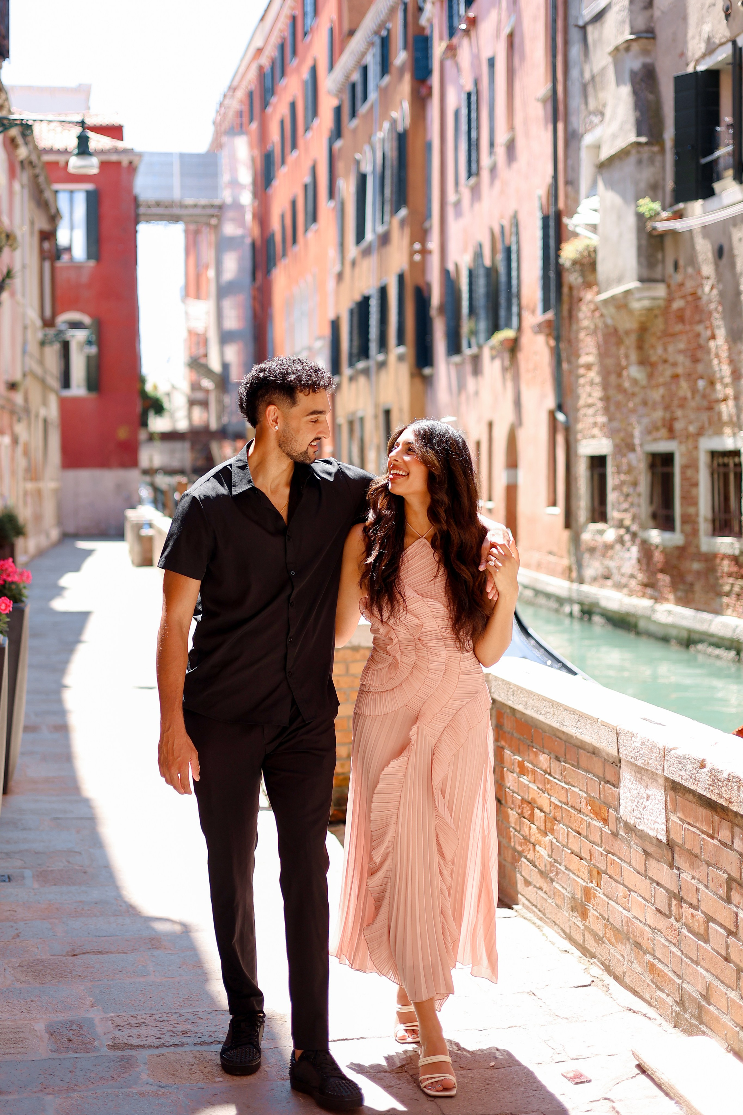 Romantic couple walking through Venice streets