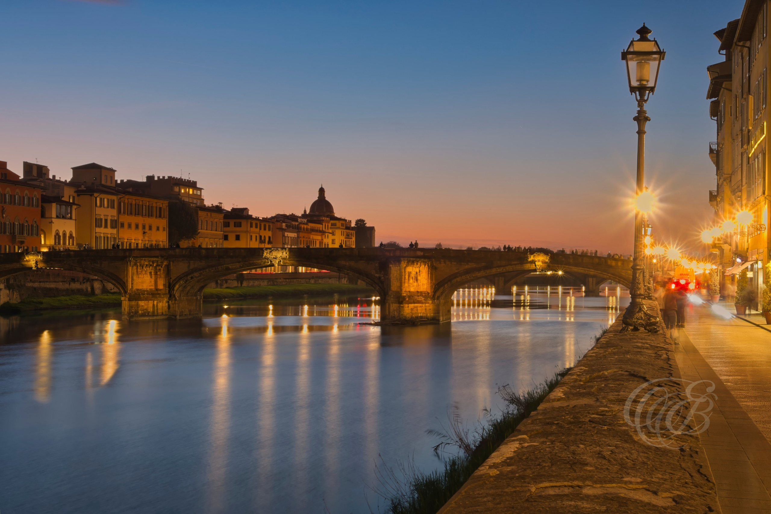 ITALY – FLORENCE — Ponte Santa Trinita Black and White — Renaissance bridge designed by Bartolomeo Ammannati spanning the Arno River with distinctive elliptical arches and historic city surroundings, Florence, Italy — Eduardo Bartoli Photography.