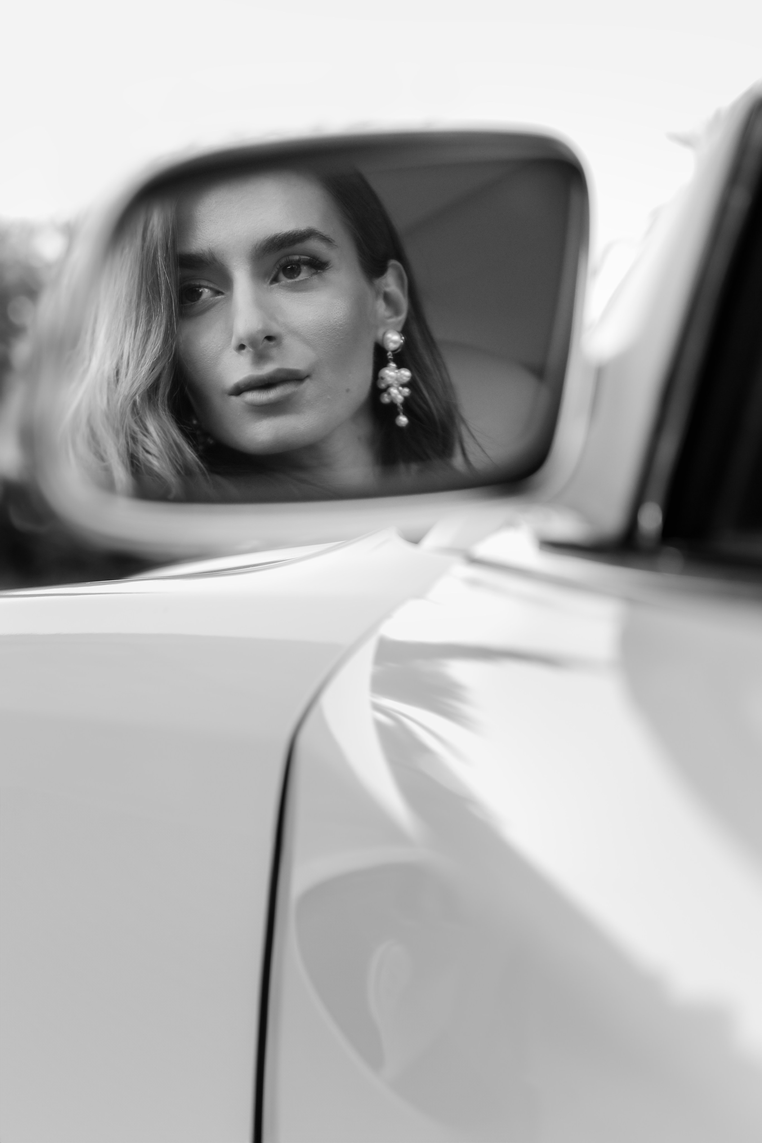 A portrait of a beautiful bride  in Rolls Royce in old town of Rhodes island, Greece