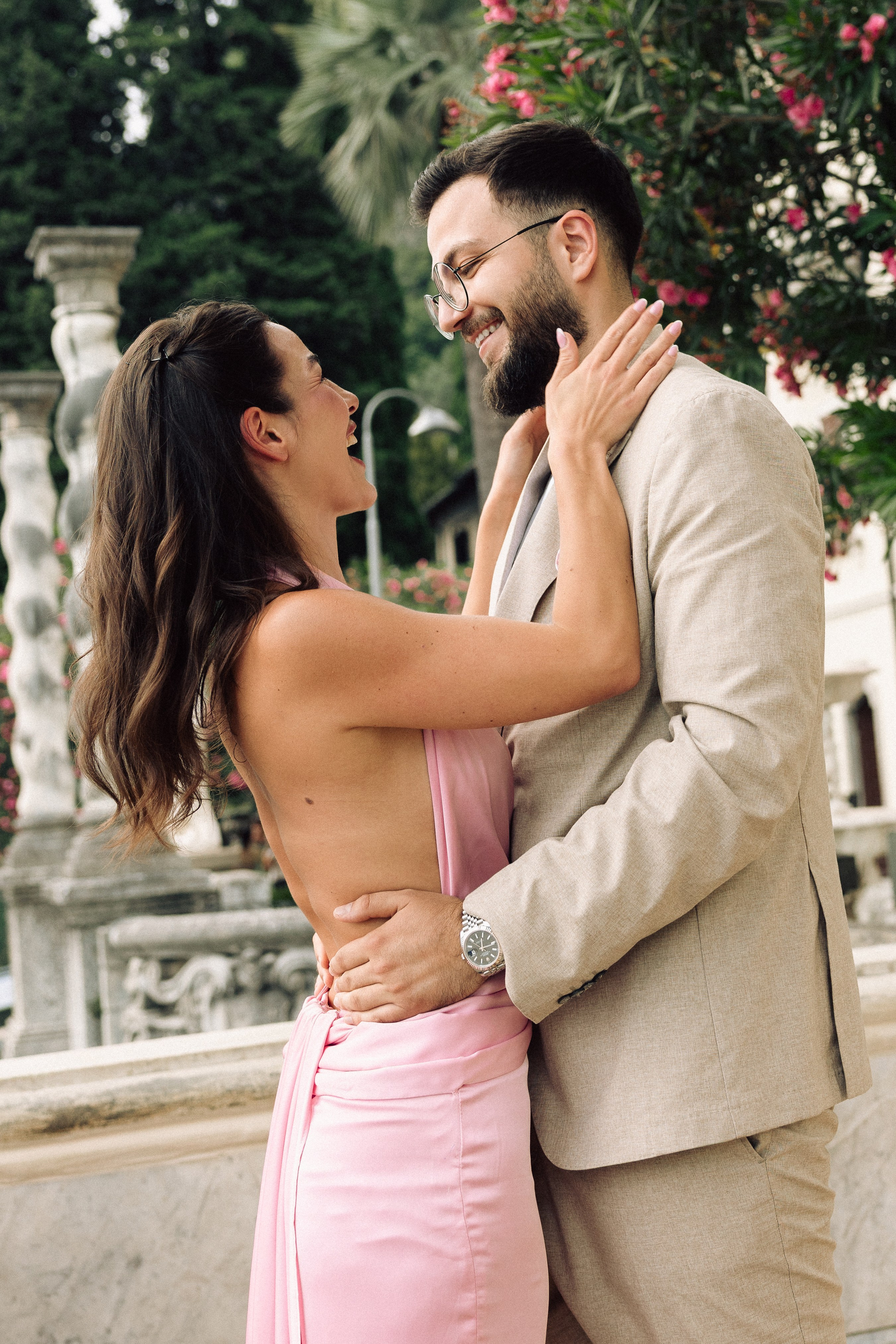 Newly engaged couple sharing a joyful moment after their Lake Como proposal