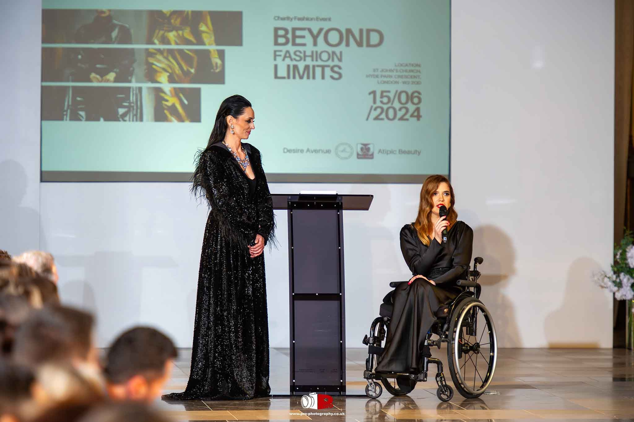A woman in a wheelchair gave a speech alongside a presenter at the Beyond Fashion Limits charity fashion event in London.