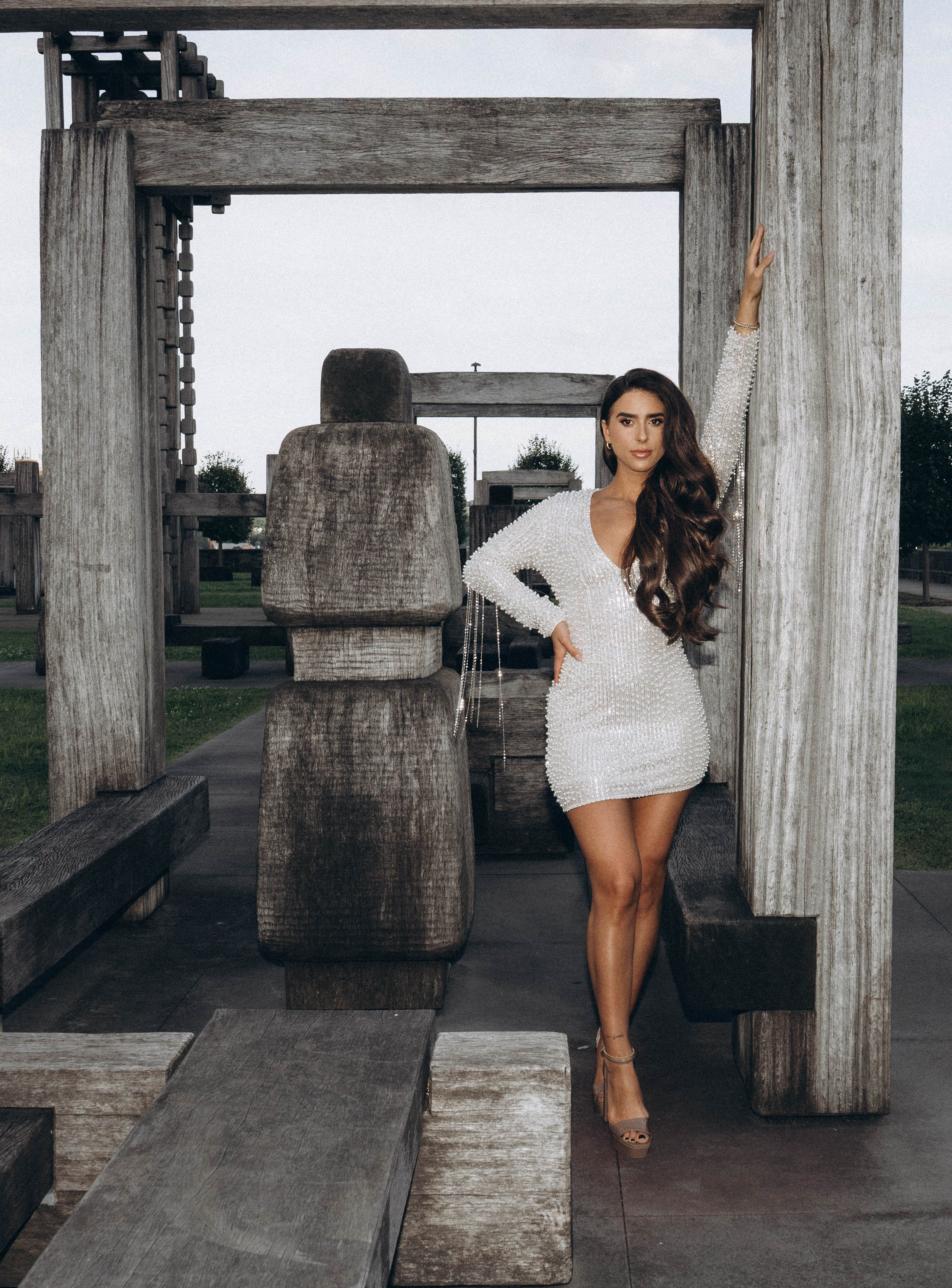 Bride smiling near Kingston marina at sunset.