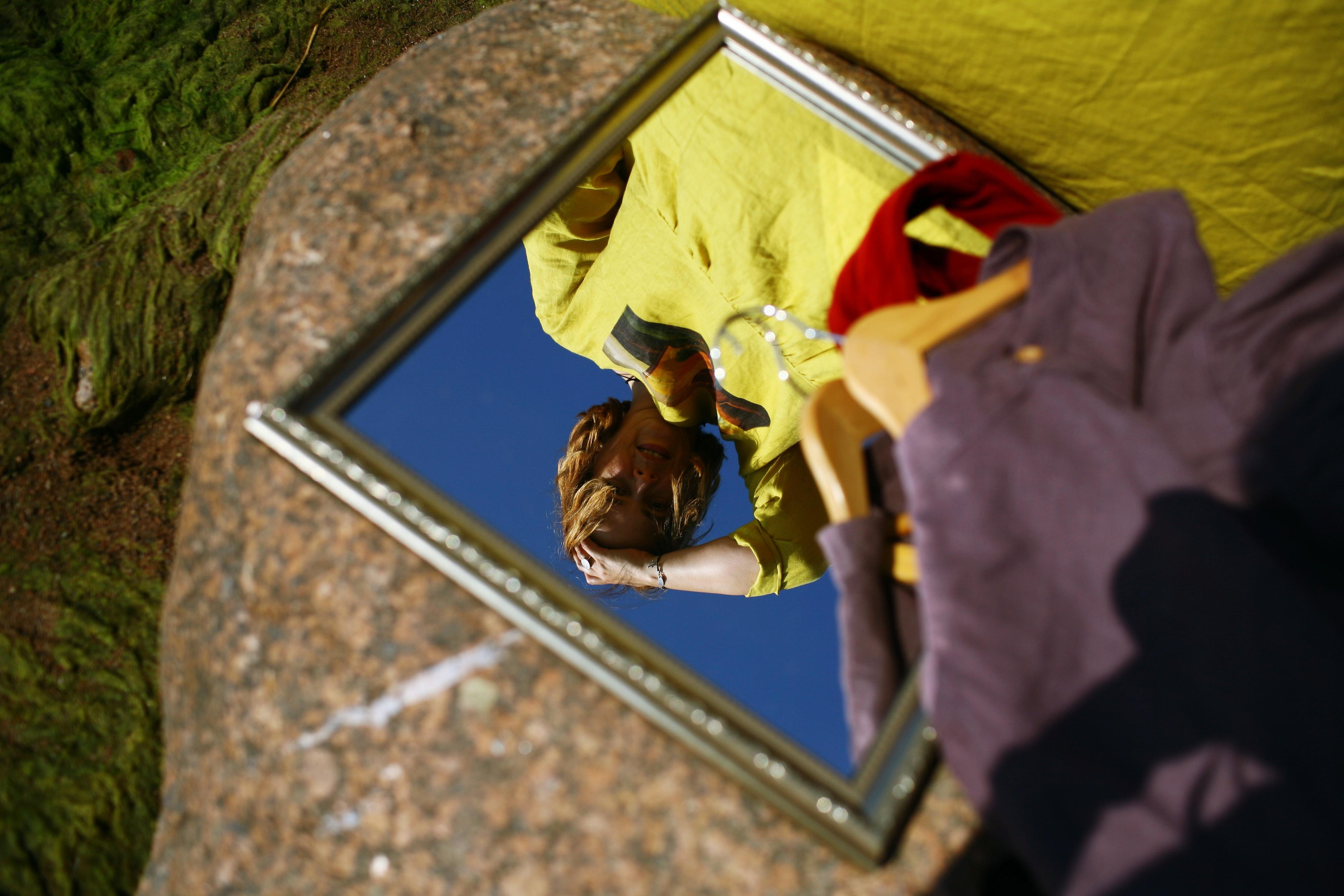 Anna, by herself. Stones and sand. Victoria Dini. Art photography in London / Folkestone, UK