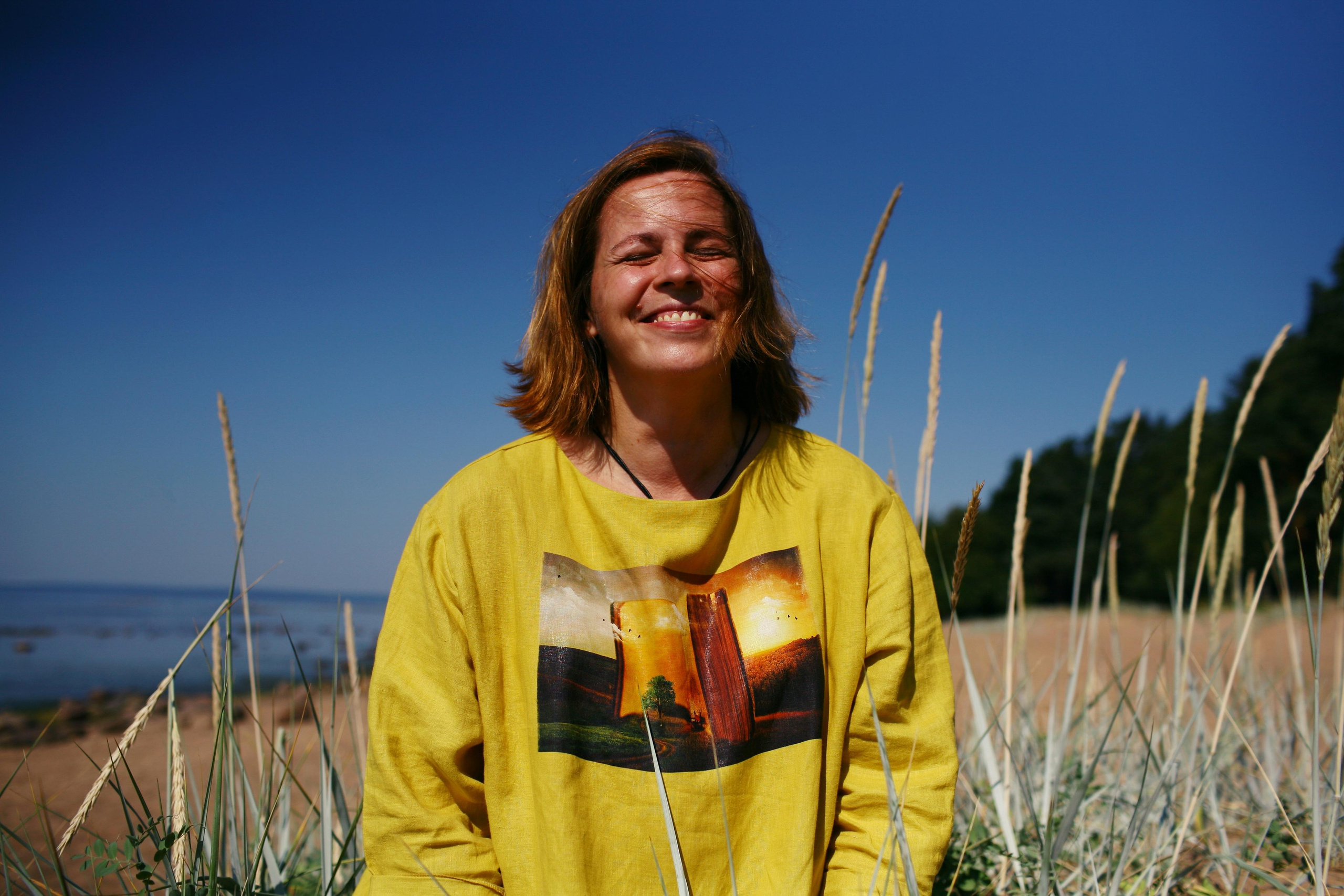 Anna, by herself. Stones and sand. Victoria Dini. Art photography in London / Folkestone, UK
