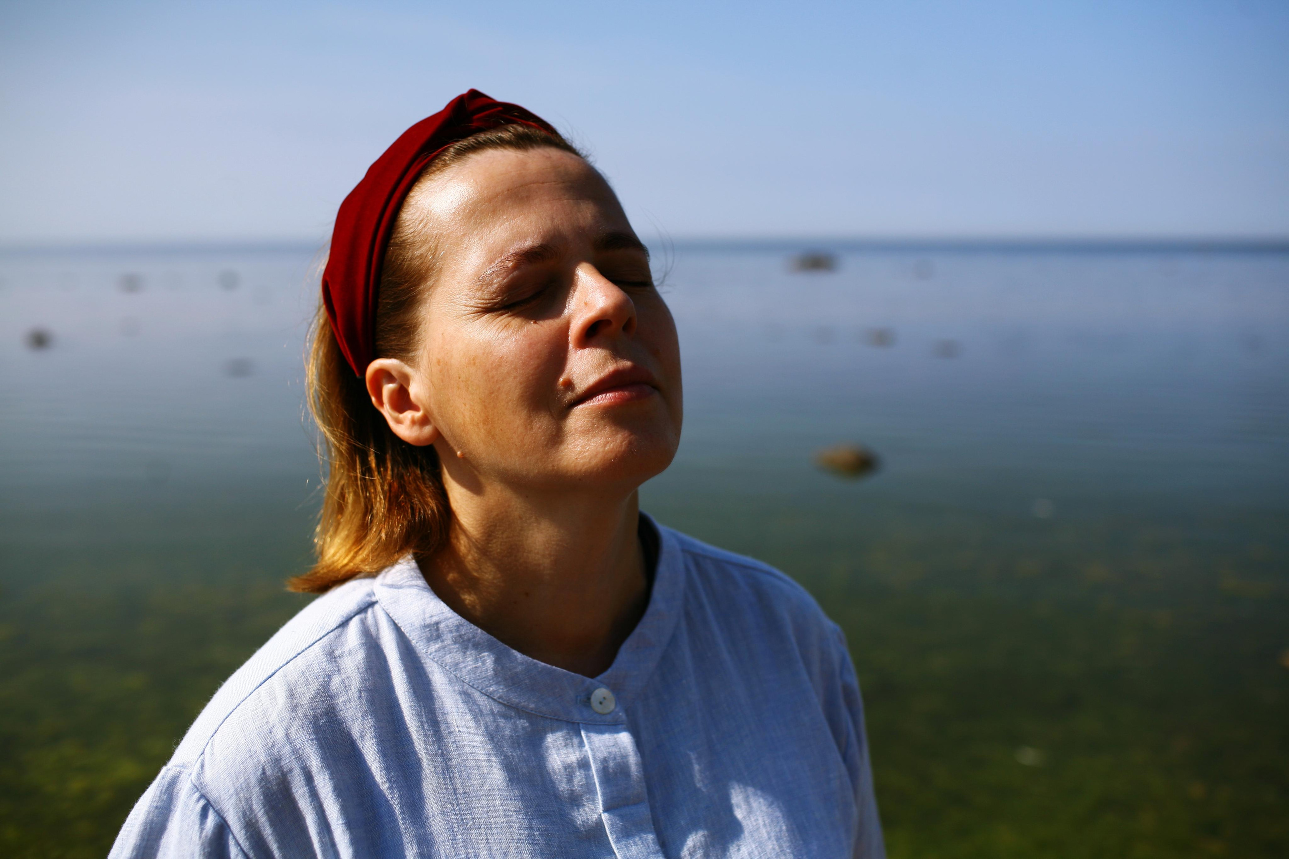 Anna, by herself. Stones and sand. Victoria Dini. Art photography in London / Folkestone, UK