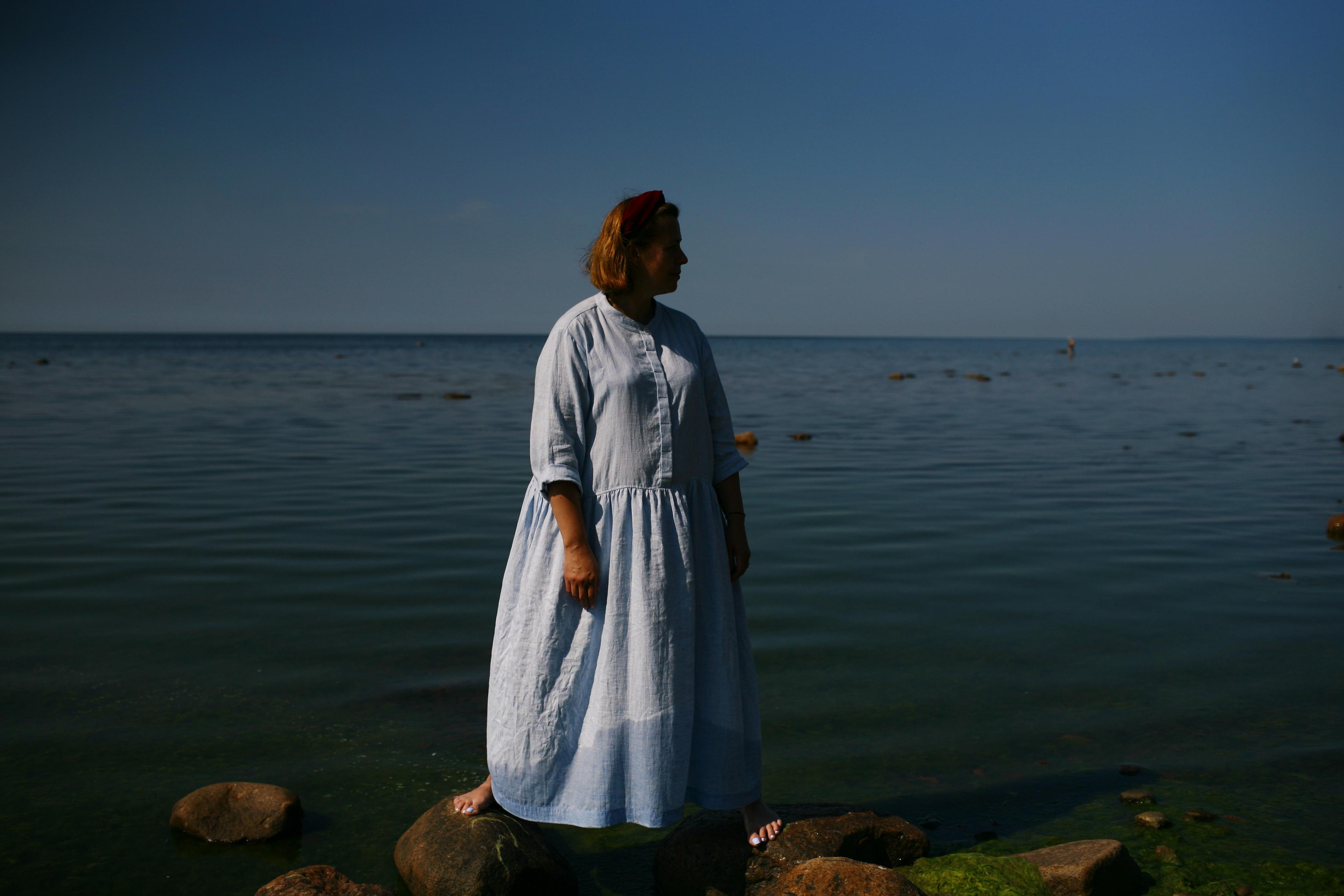 Anna, by herself. Stones and sand. Victoria Dini. Art photography in London / Folkestone, UK