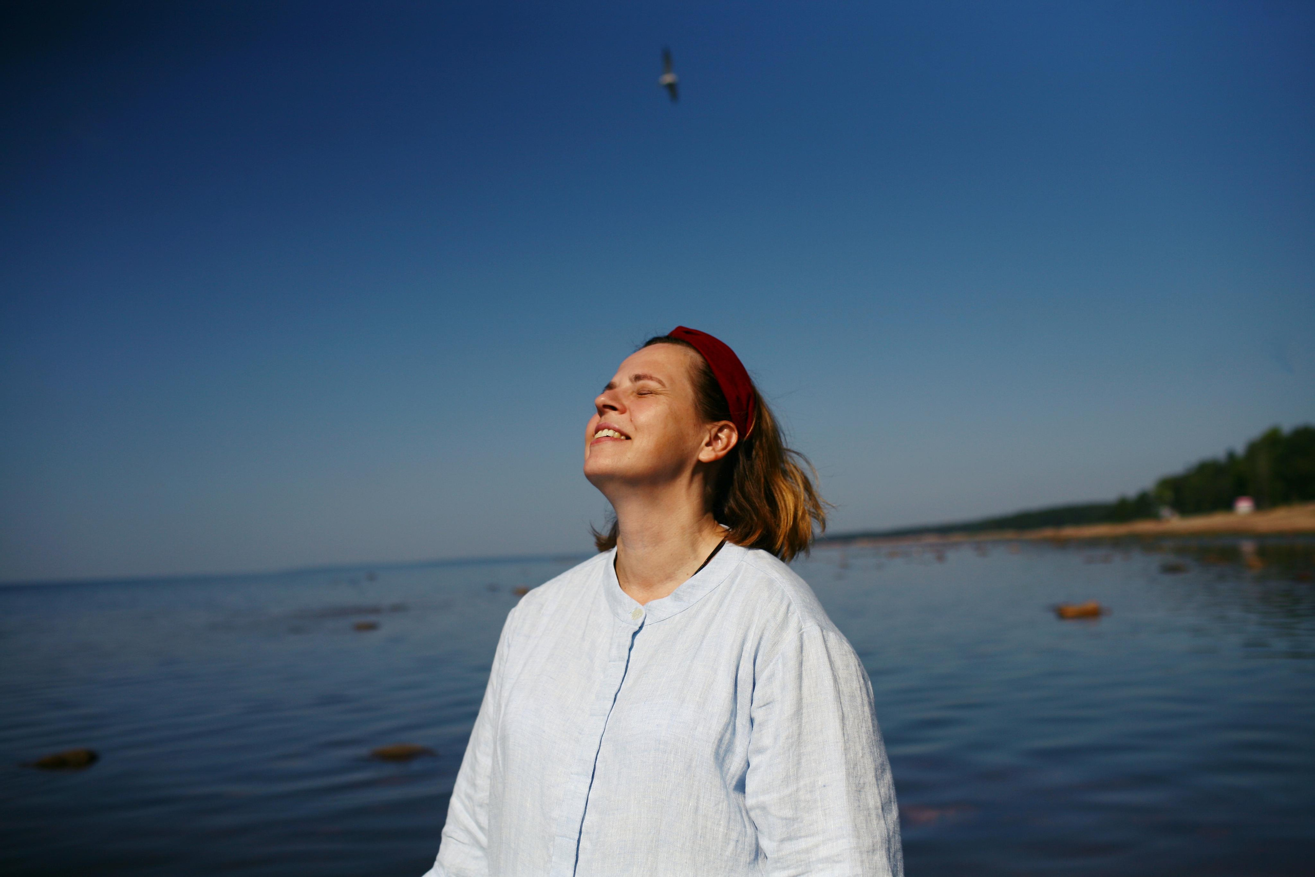 Anna, by herself. Stones and sand. Victoria Dini. Art photography in London / Folkestone, UK