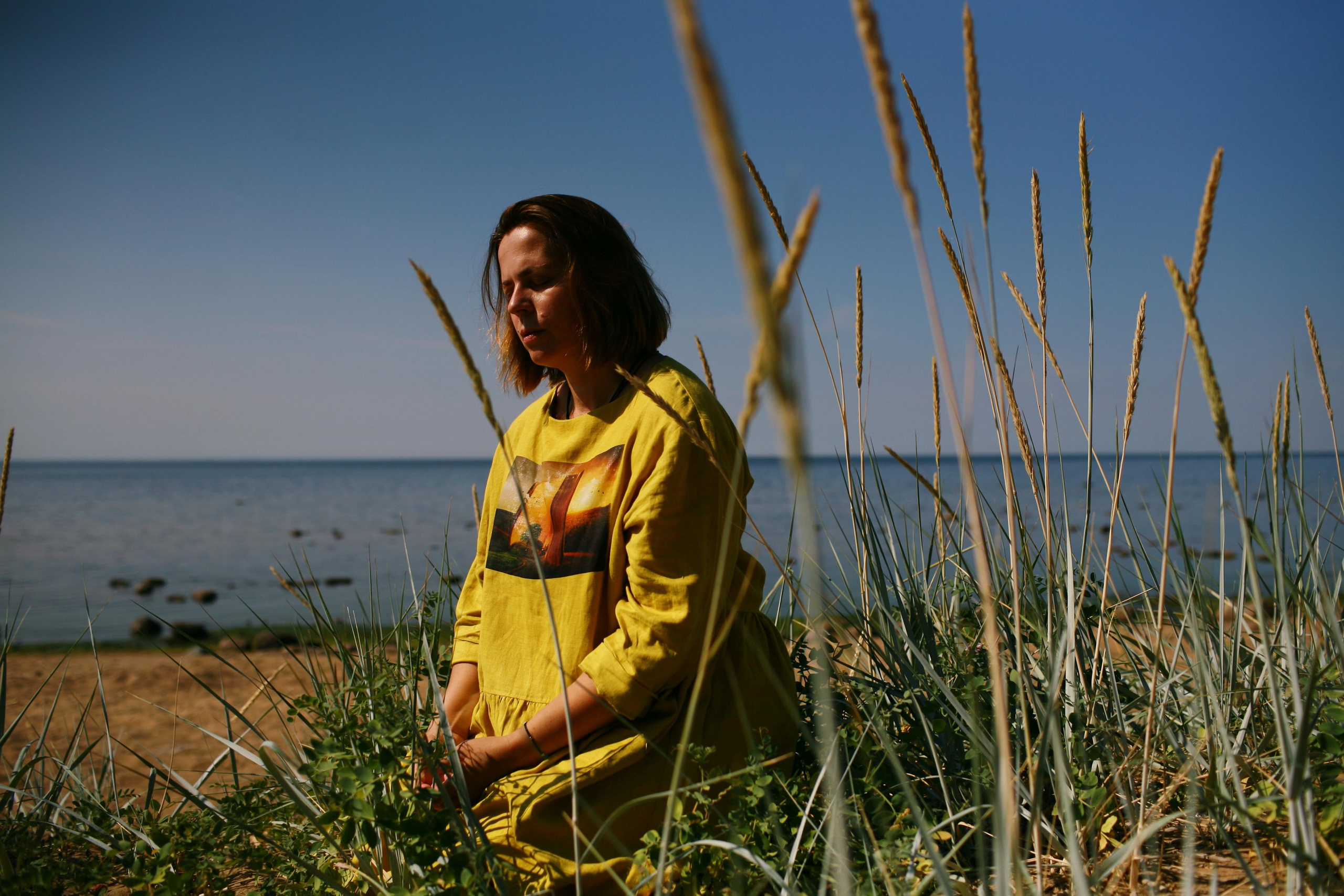 Anna, by herself. Stones and sand. Victoria Dini. Art photography in London / Folkestone, UK