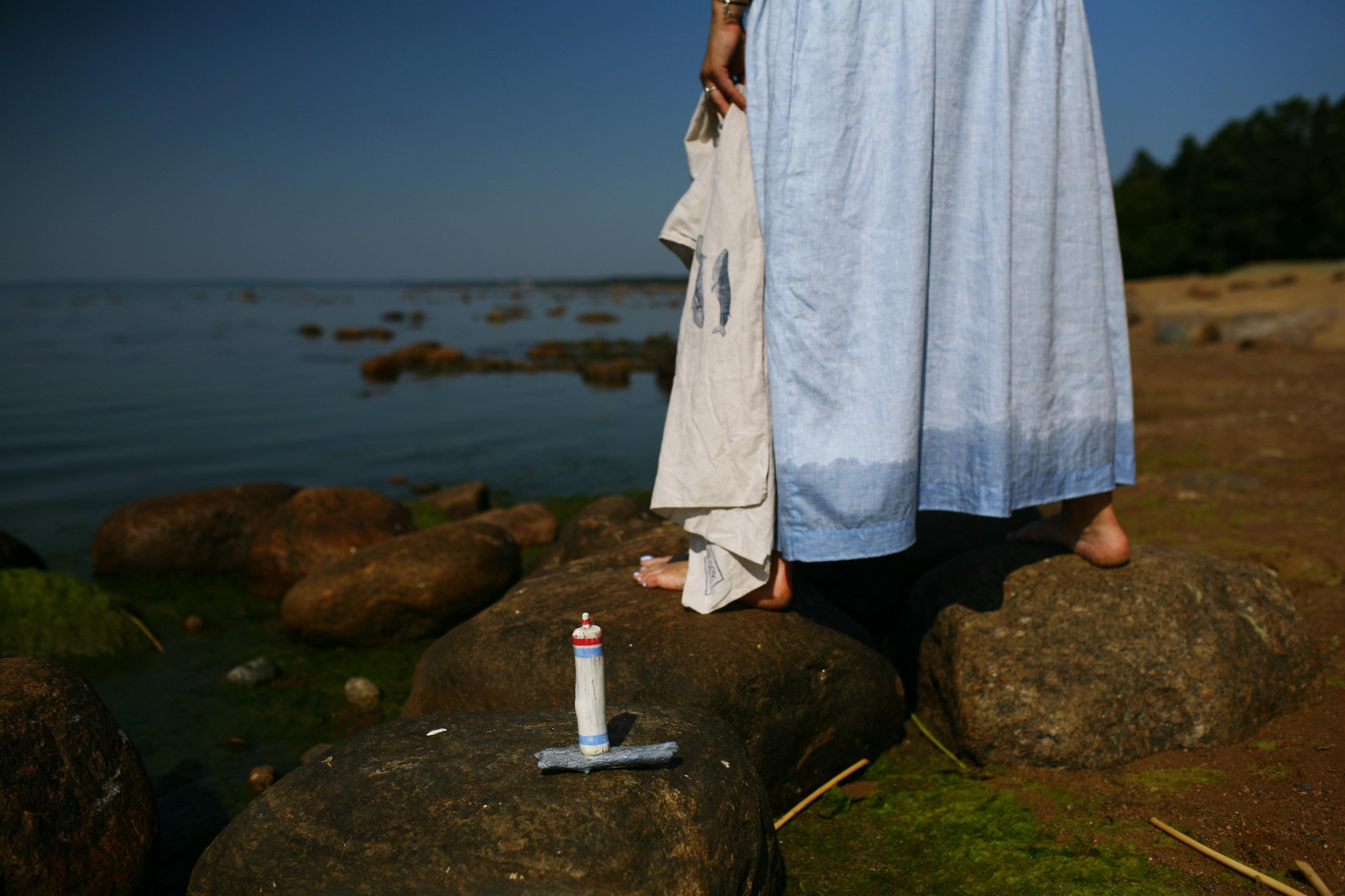 Anna, by herself. Stones and sand. Victoria Dini. Art photography in London / Folkestone, UK