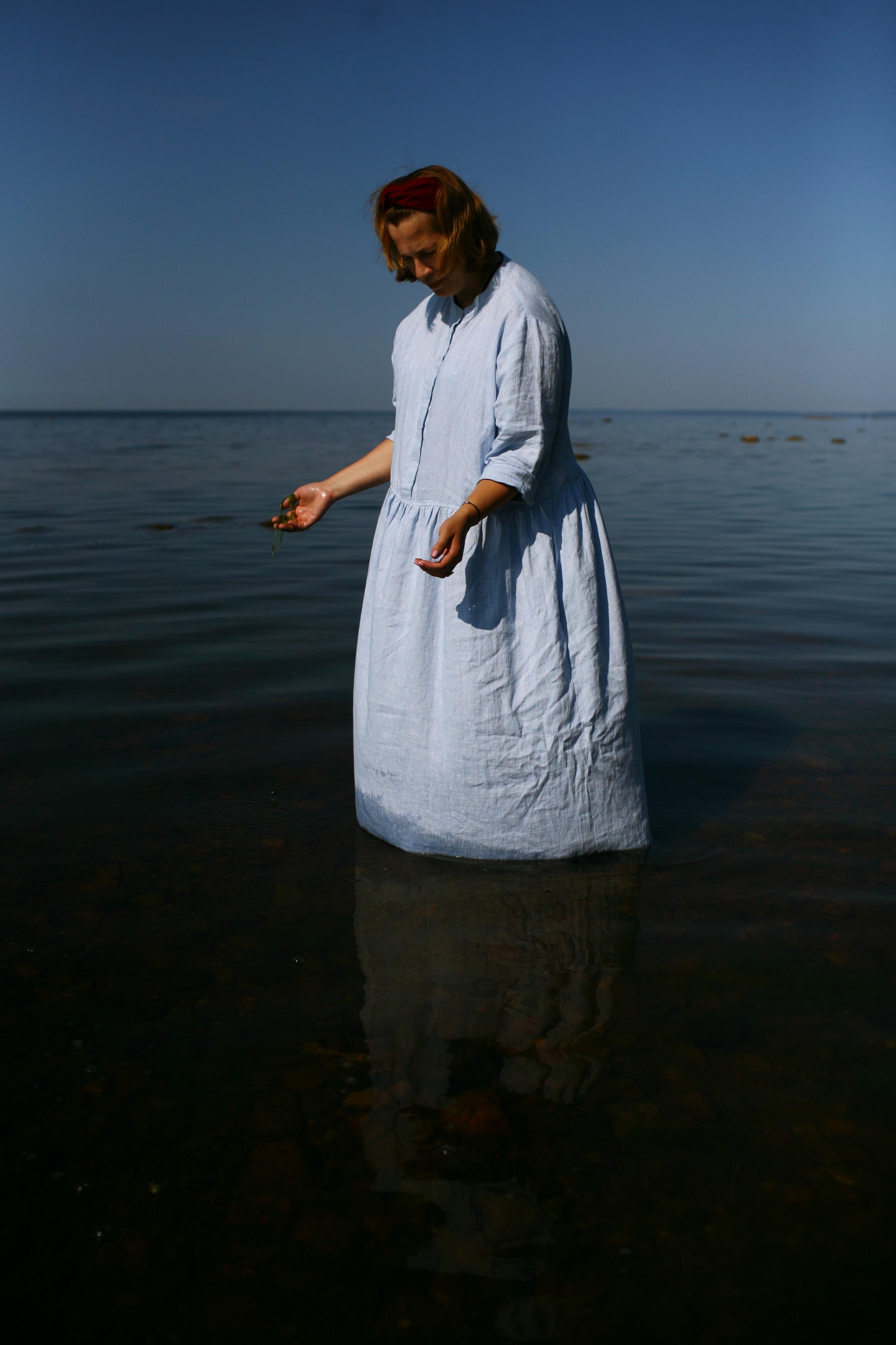 Anna, by herself. Stones and sand. Victoria Dini. Art photography in London / Folkestone, UK