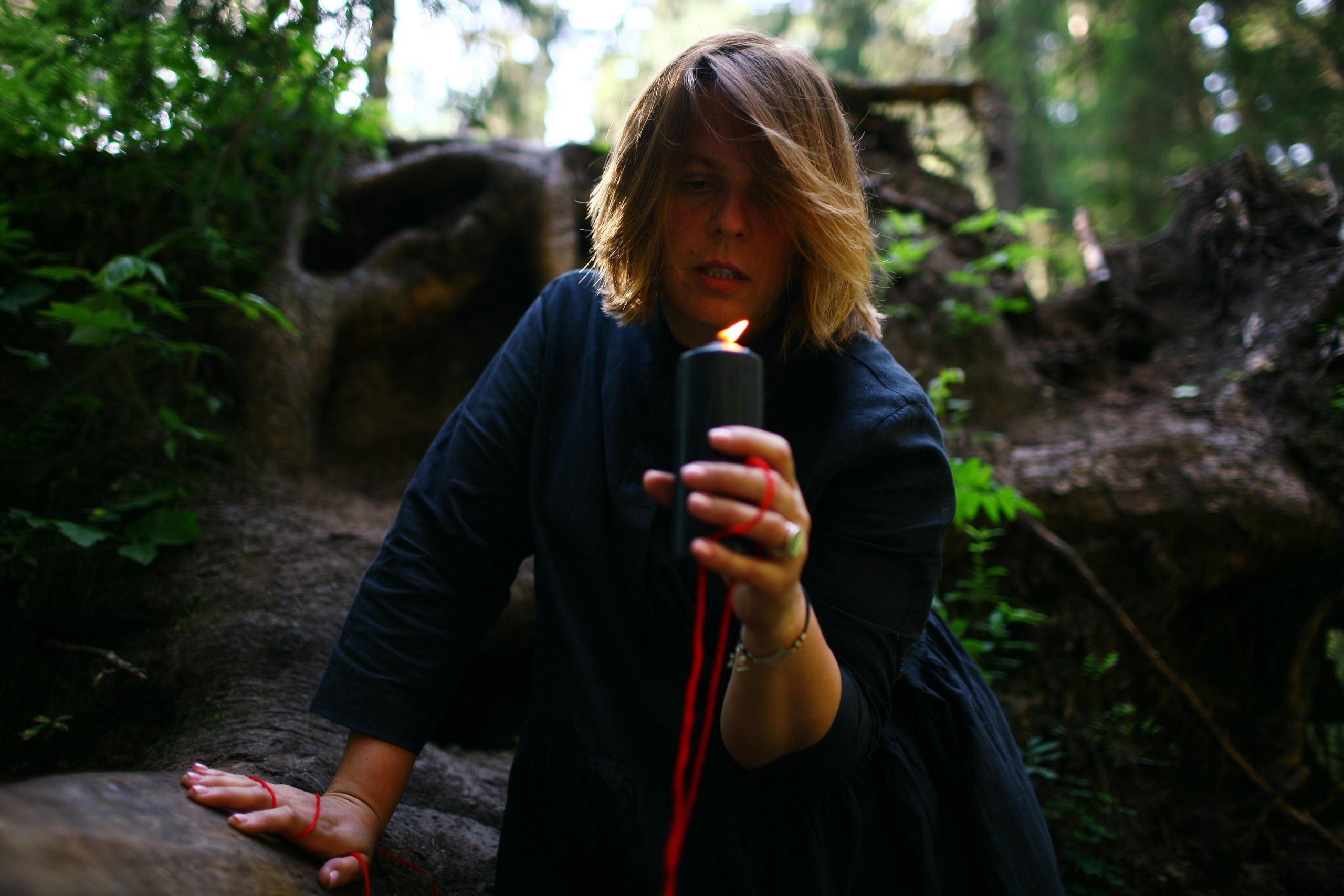 Anna, by&nbsp;herself. Woods and a&nbsp;little bit fire