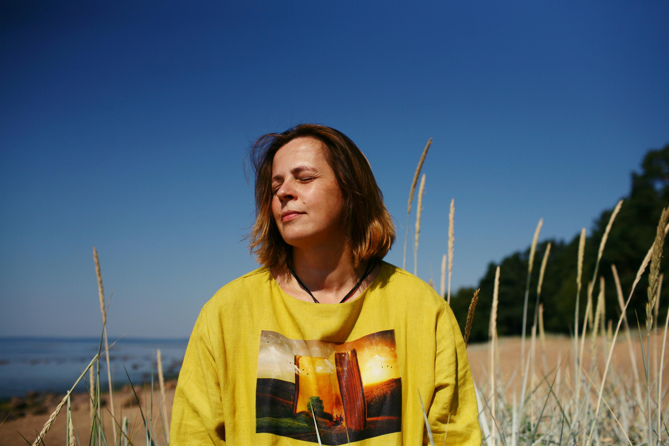 Anna, by herself. Stones and sand. Victoria Dini. Art photography in London / Folkestone, UK