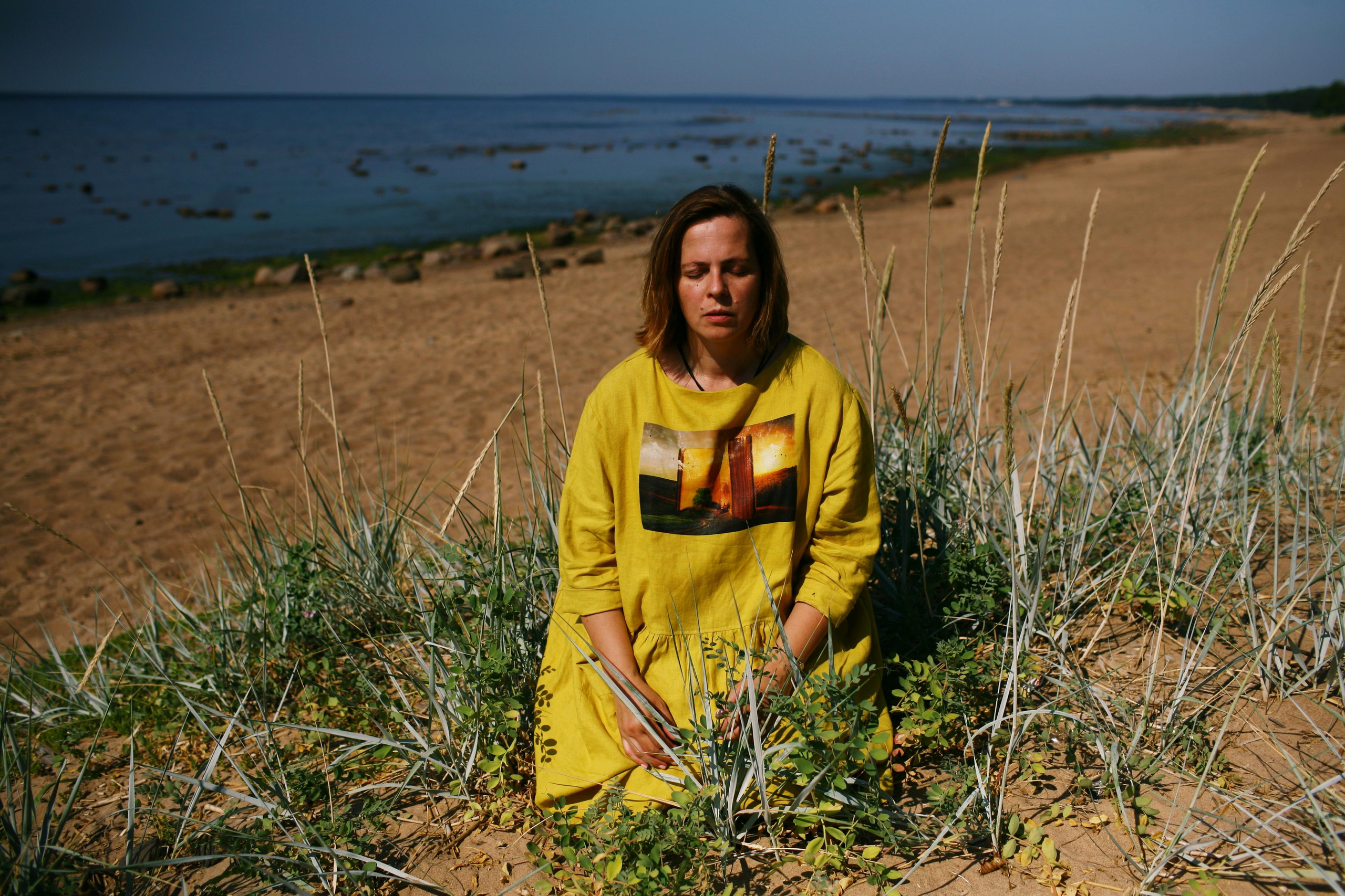 Anna, by herself. Stones and sand. Victoria Dini. Art photography in London / Folkestone, UK