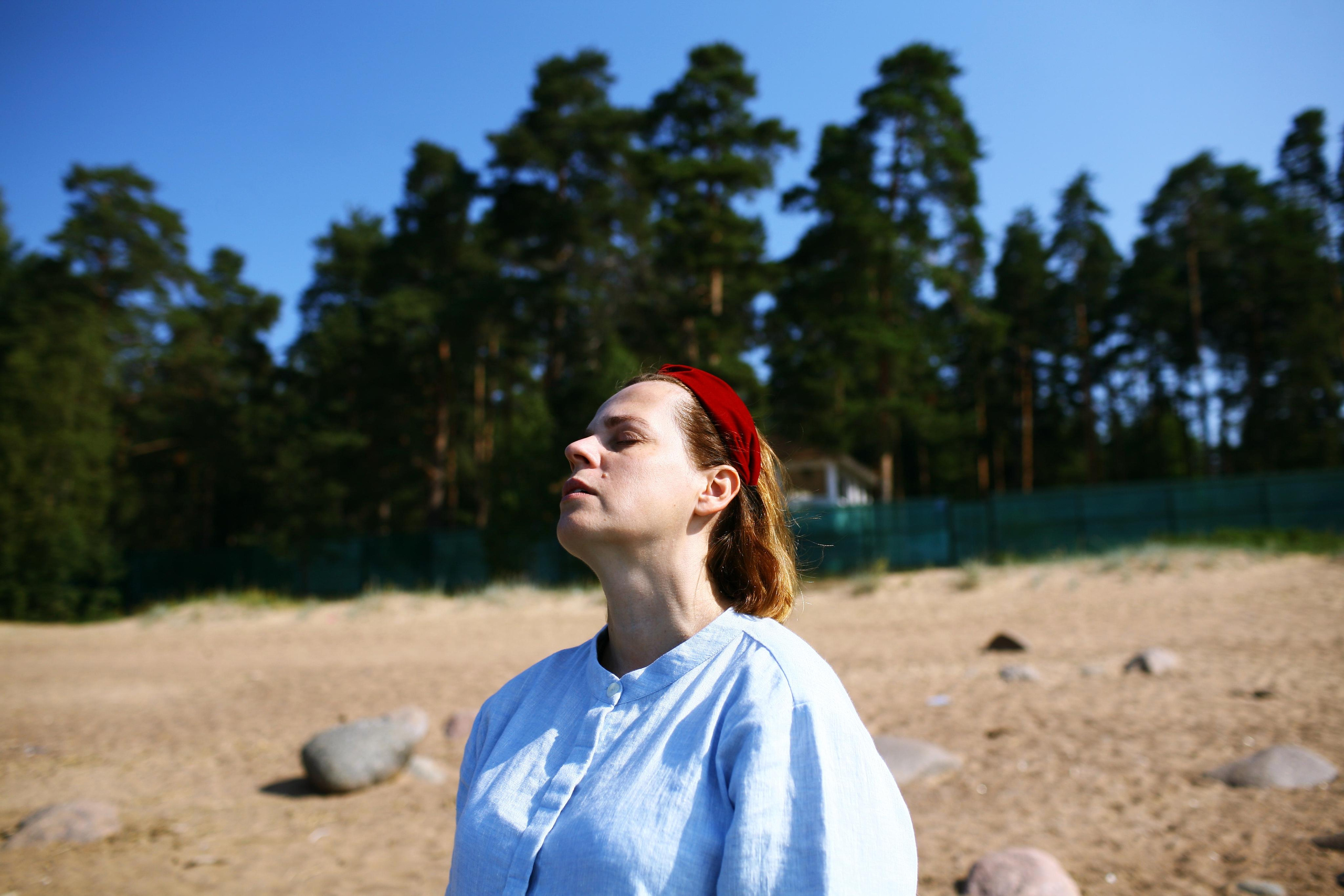 Anna, by herself. Stones and sand. Victoria Dini. Art photography in London / Folkestone, UK