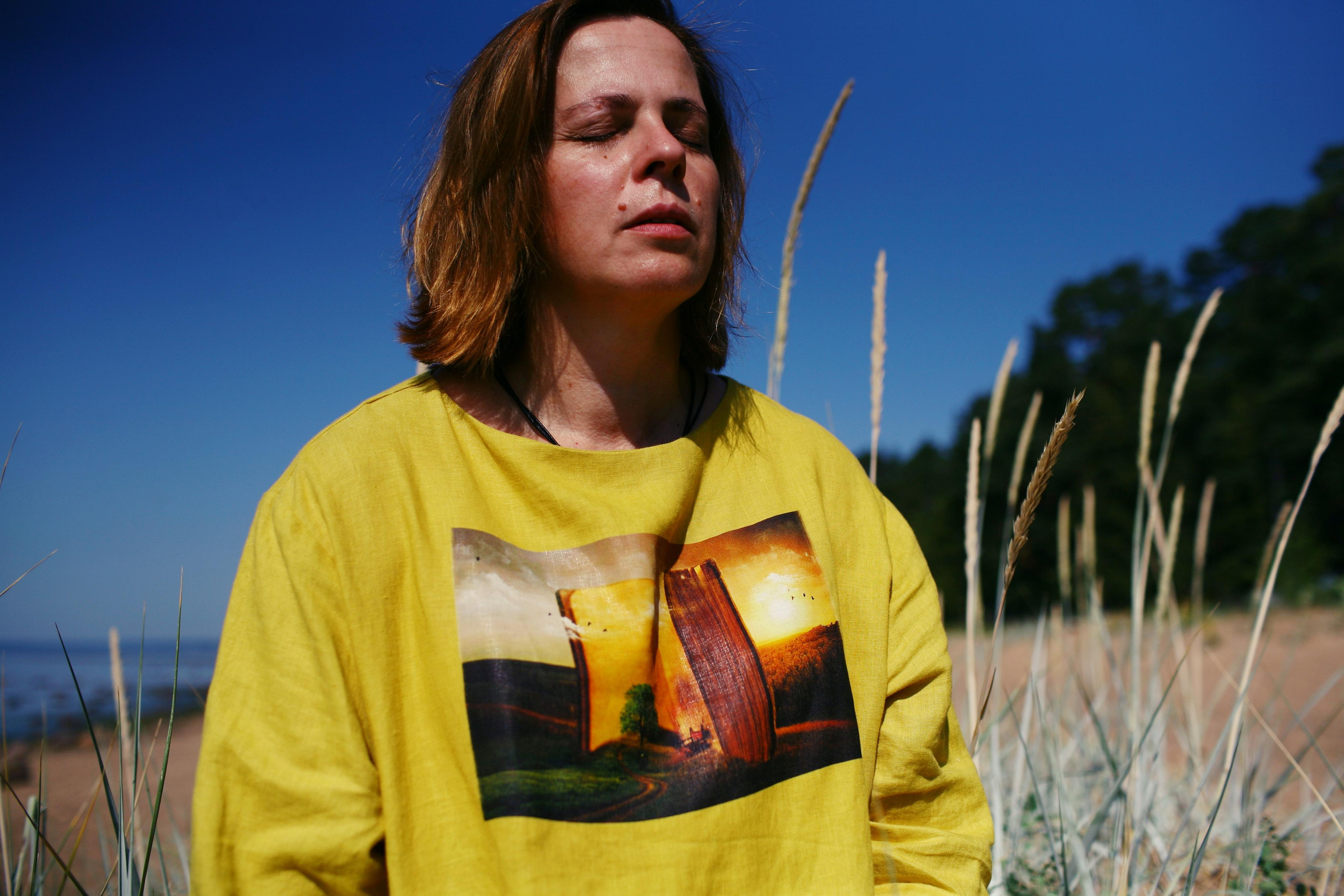 Anna, by herself. Stones and sand. Victoria Dini. Art photography in London / Folkestone, UK