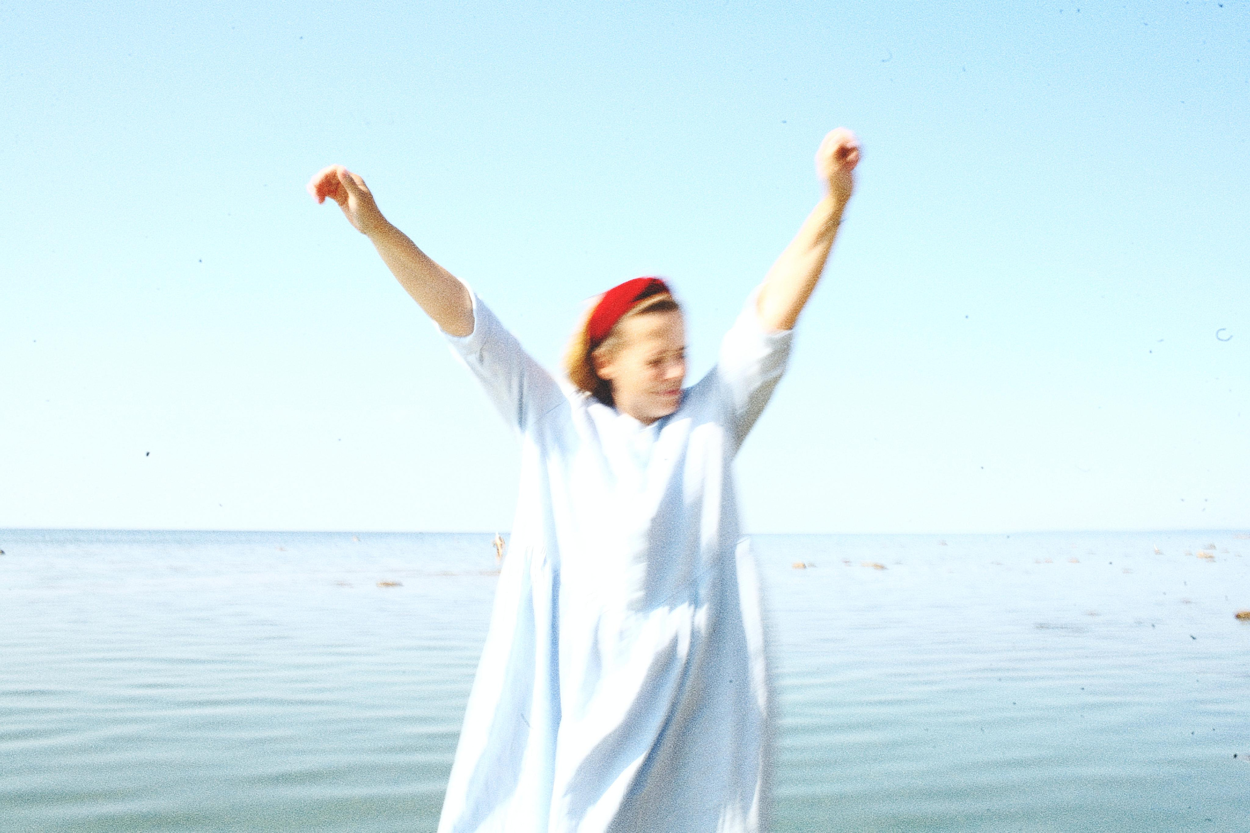 Anna, by herself. Stones and sand. Victoria Dini. Art photography in London / Folkestone, UK