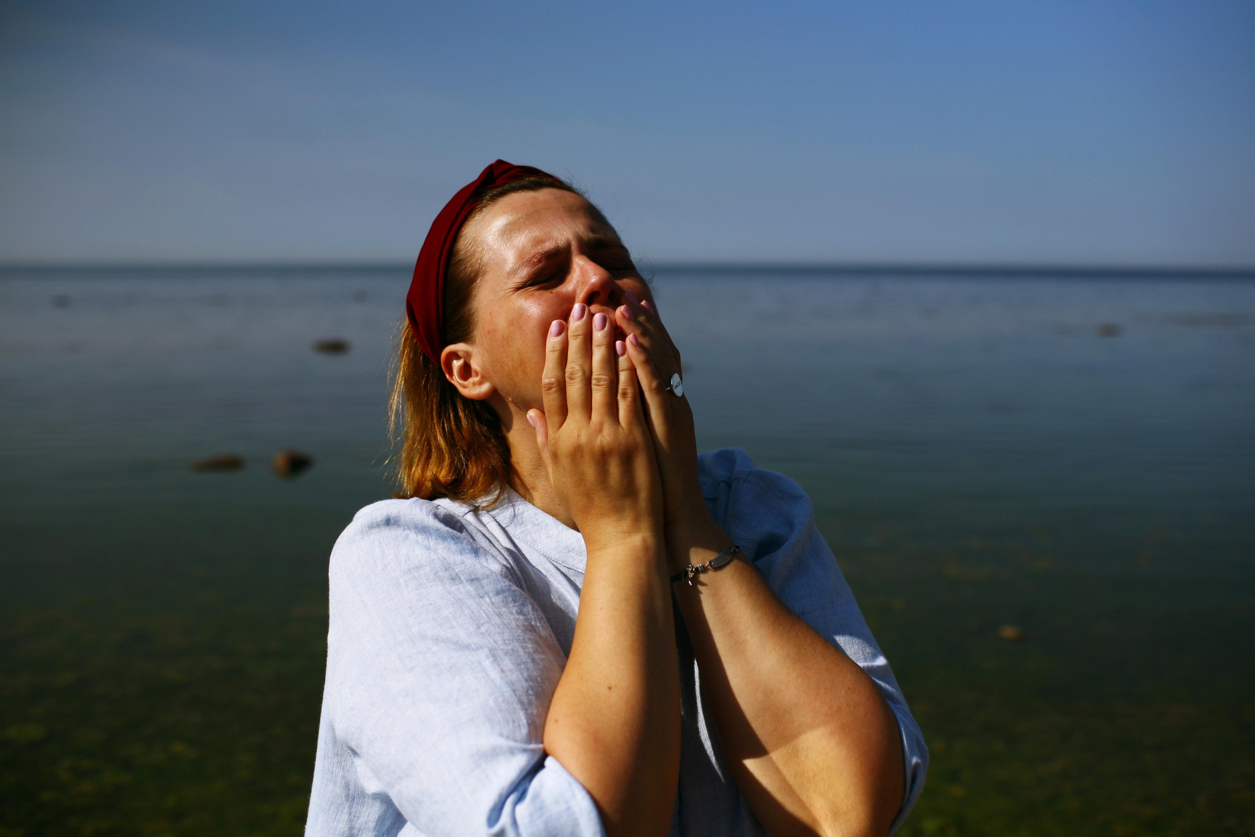 Anna, by herself. Stones and sand. Victoria Dini. Art photography in London / Folkestone, UK