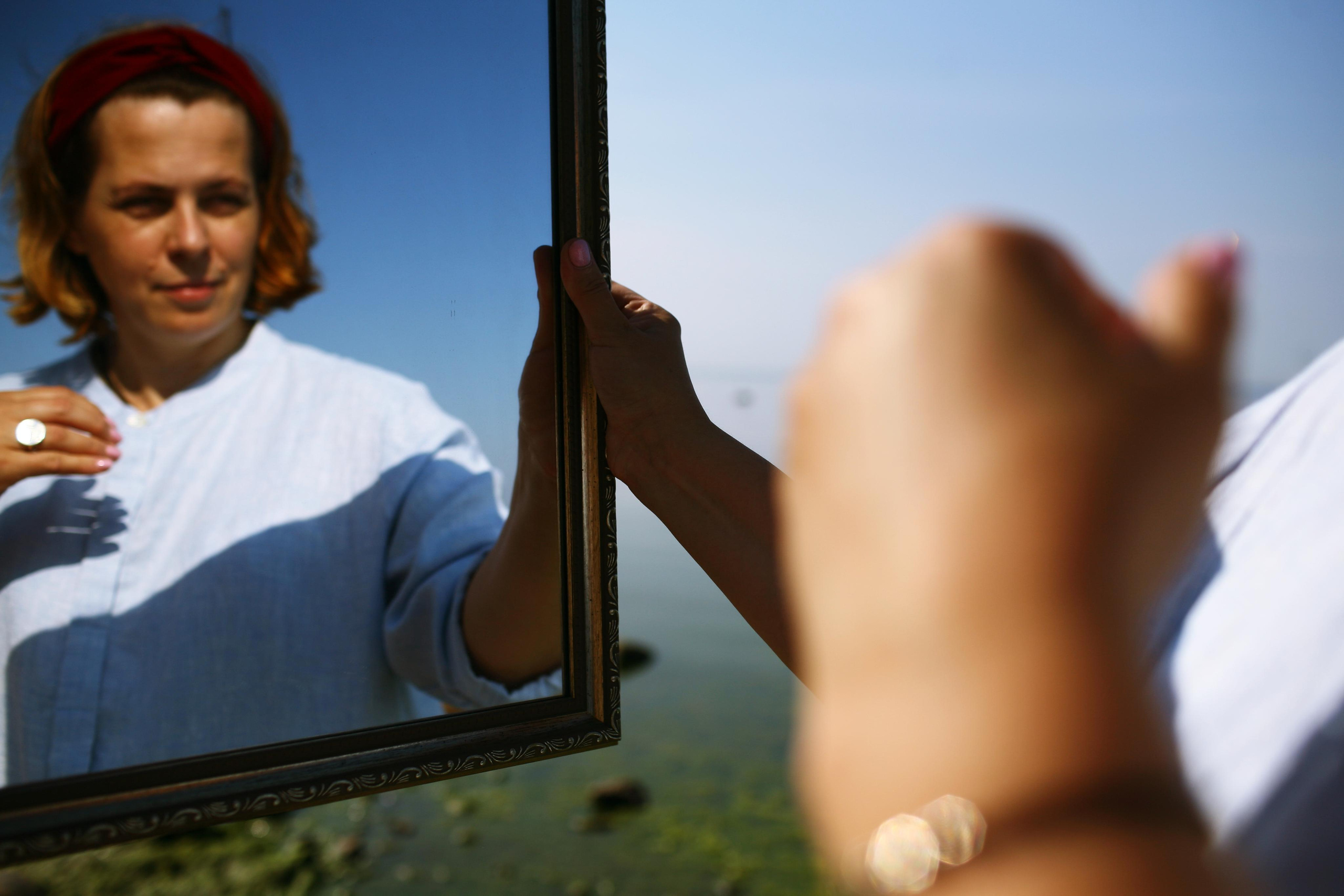 Anna, by herself. Stones and sand. Victoria Dini. Art photography in London / Folkestone, UK