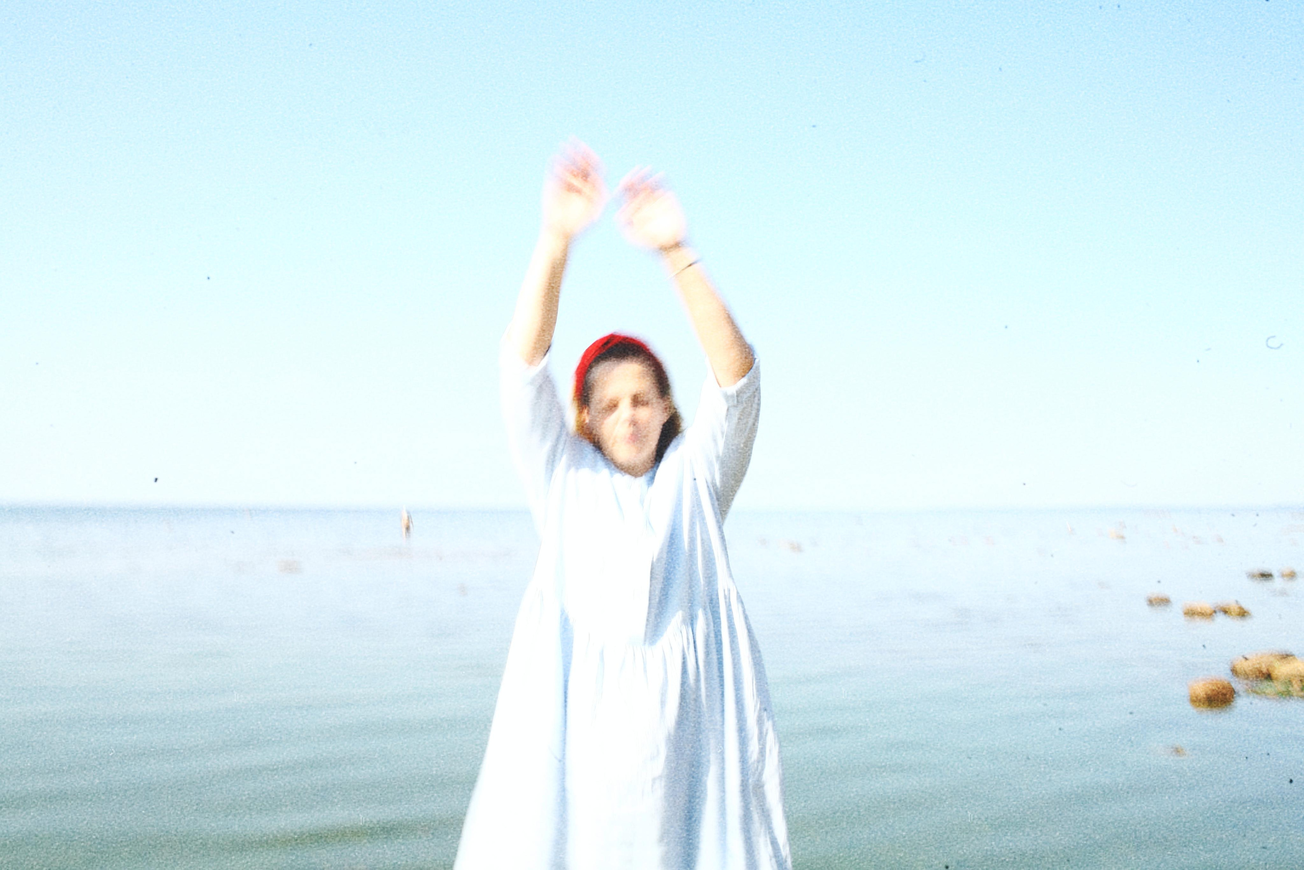 Anna, by herself. Stones and sand. Victoria Dini. Art photography in London / Folkestone, UK