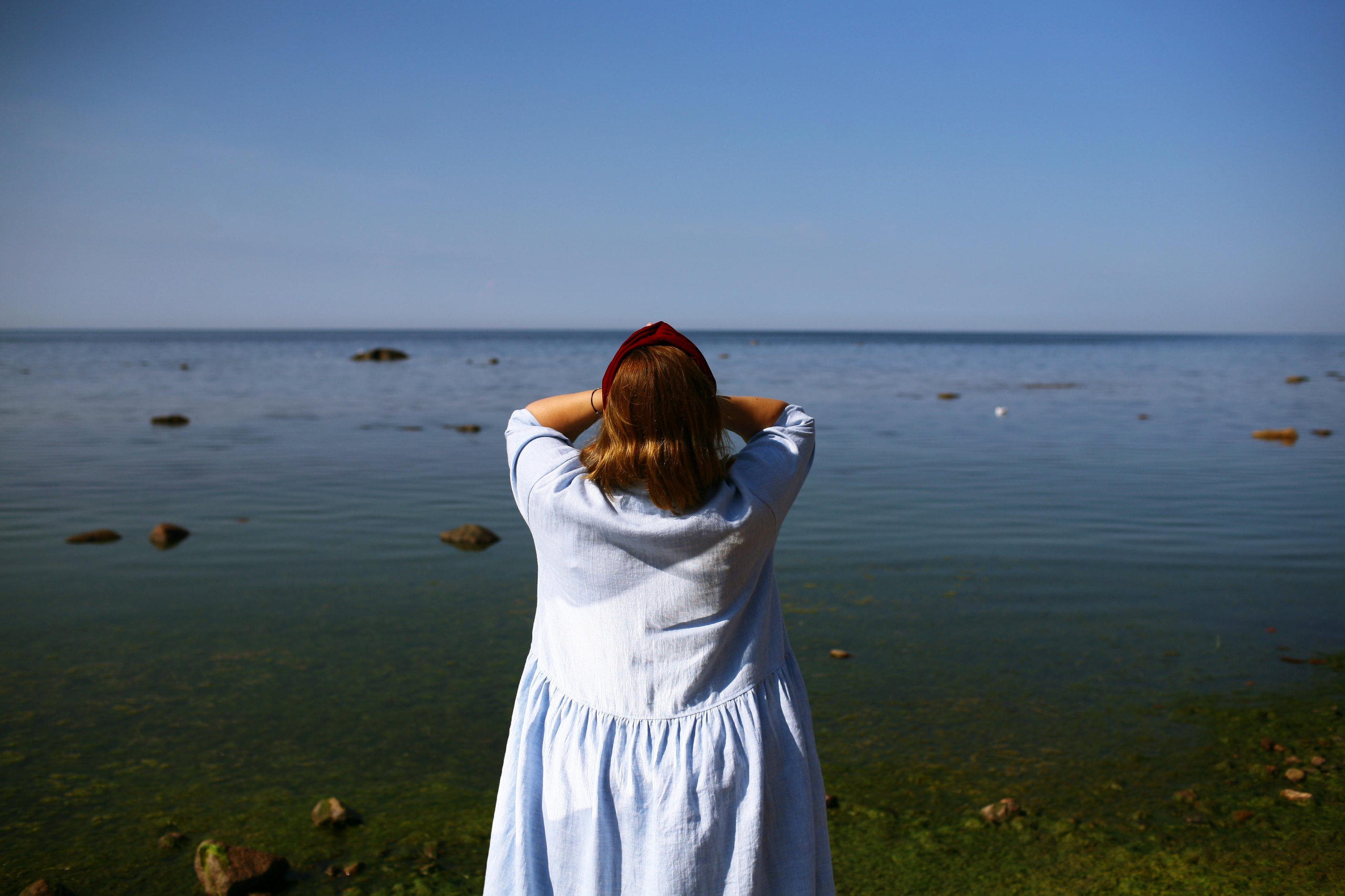 Anna, by herself. Stones and sand. Victoria Dini. Art photography in London / Folkestone, UK