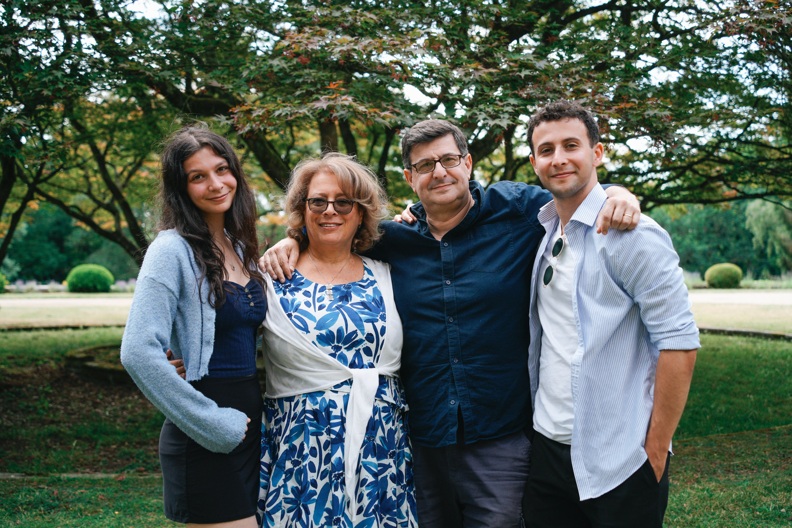 Three-generation family smiling outside in Hampton-in-Arden on grandma’s 90th.